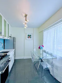 a room with furniture and chandelier