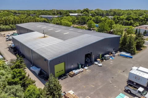 an aerial view of a house having yard
