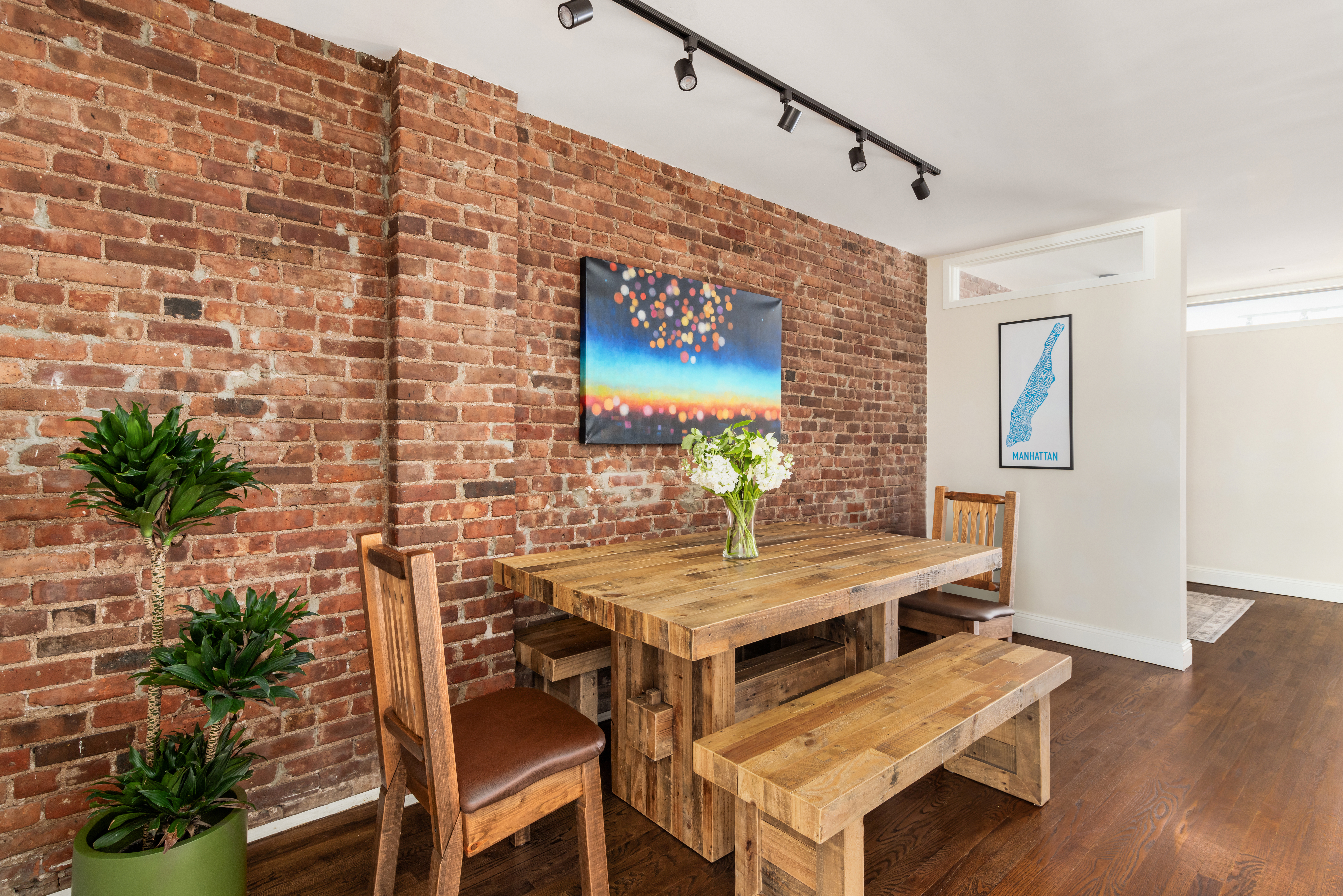 99 Reade Street, Unit 5E Manhattan, NY 10013 - Photo 5 of 13 a view of a dining room with furniture and wooden floor