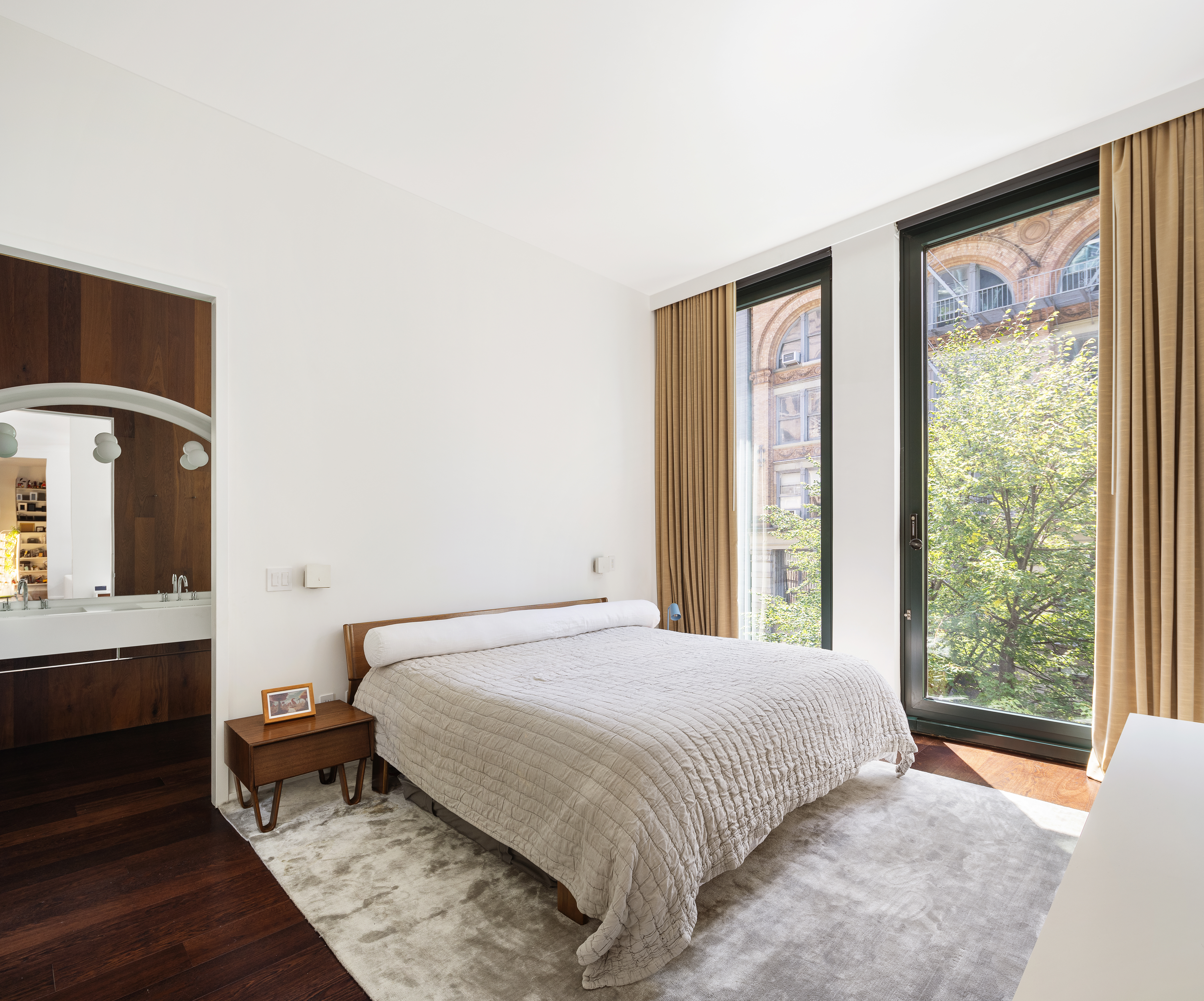 40 Bond Street, Unit 4B Manhattan, NY 10012 - Photo 4 of 9 a bedroom with a bed and window