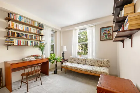 a living room with furniture and a window