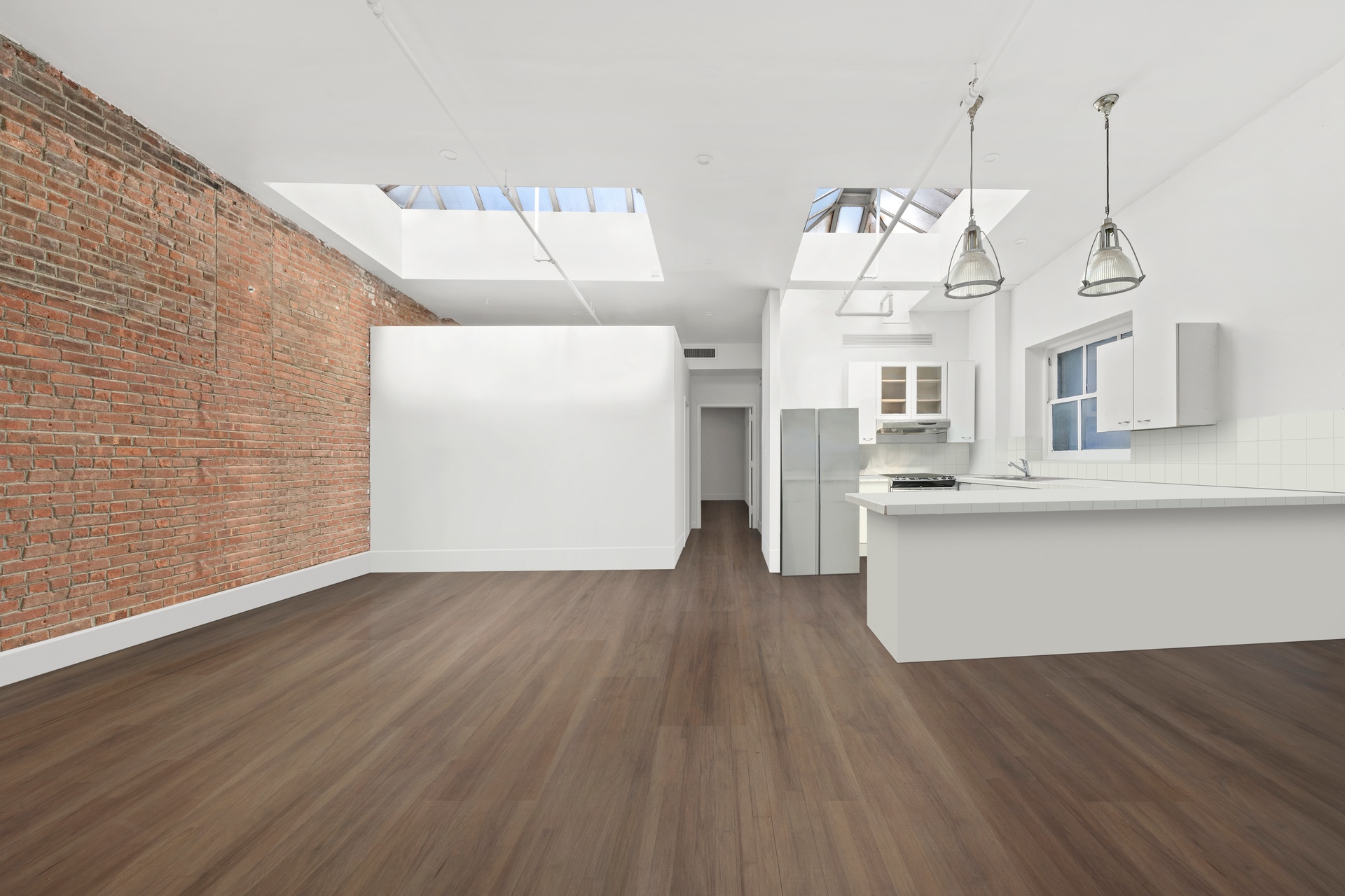 99 Spring Street, Unit PH Manhattan, NY 10012 - Photo 13 of 23 a view of a room with wooden floor and cabinet