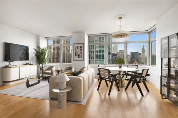 a dinning room with furniture window and wooden floor