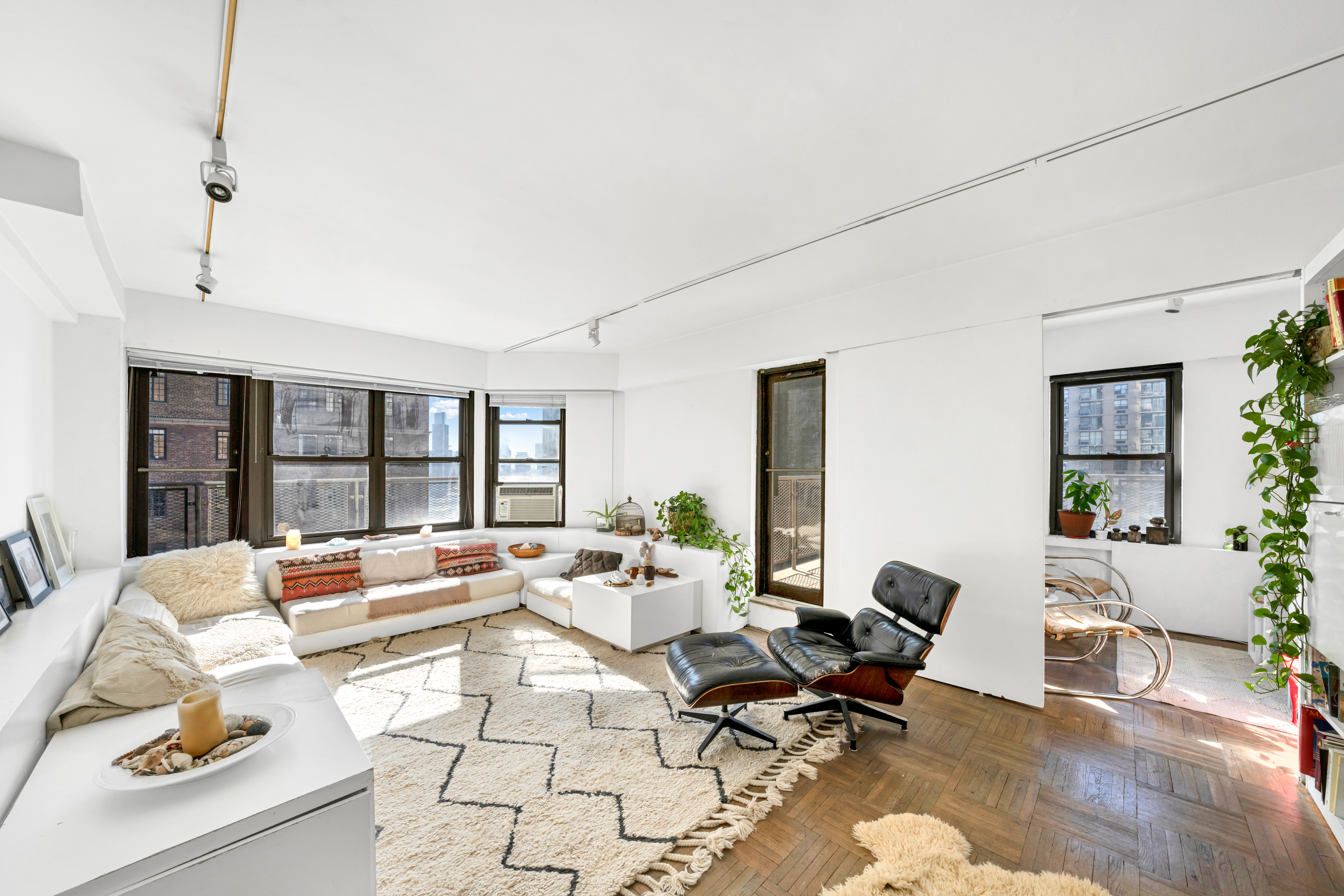 2 Tudor City Place, Unit 15AS Manhattan, NY 10017 - Photo 11 of 17 a living room with furniture and a table
