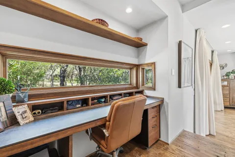 a bathroom with a sink toilet and a mirror
