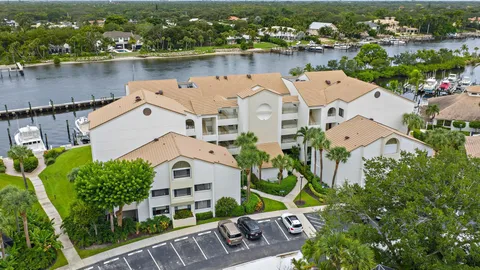 an aerial view of a house with a lake view