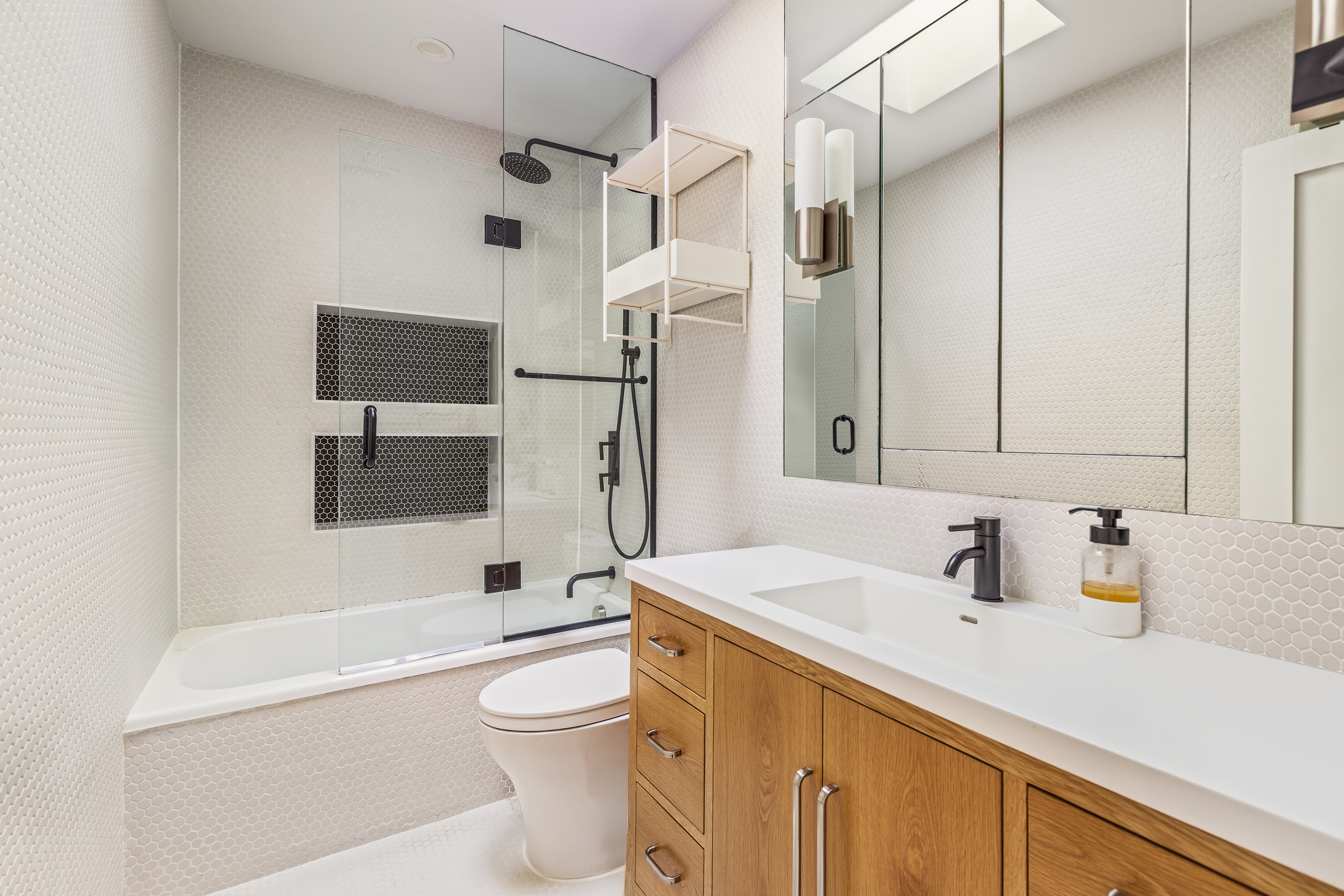 211 14th Street Brooklyn, NY 11215 - Photo 9 of 18 a bathroom with a sink a toilet and shower