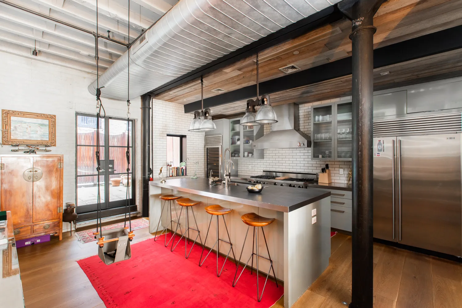 a kitchen with stainless steel appliances granite countertop a sink and a wooden cabinets