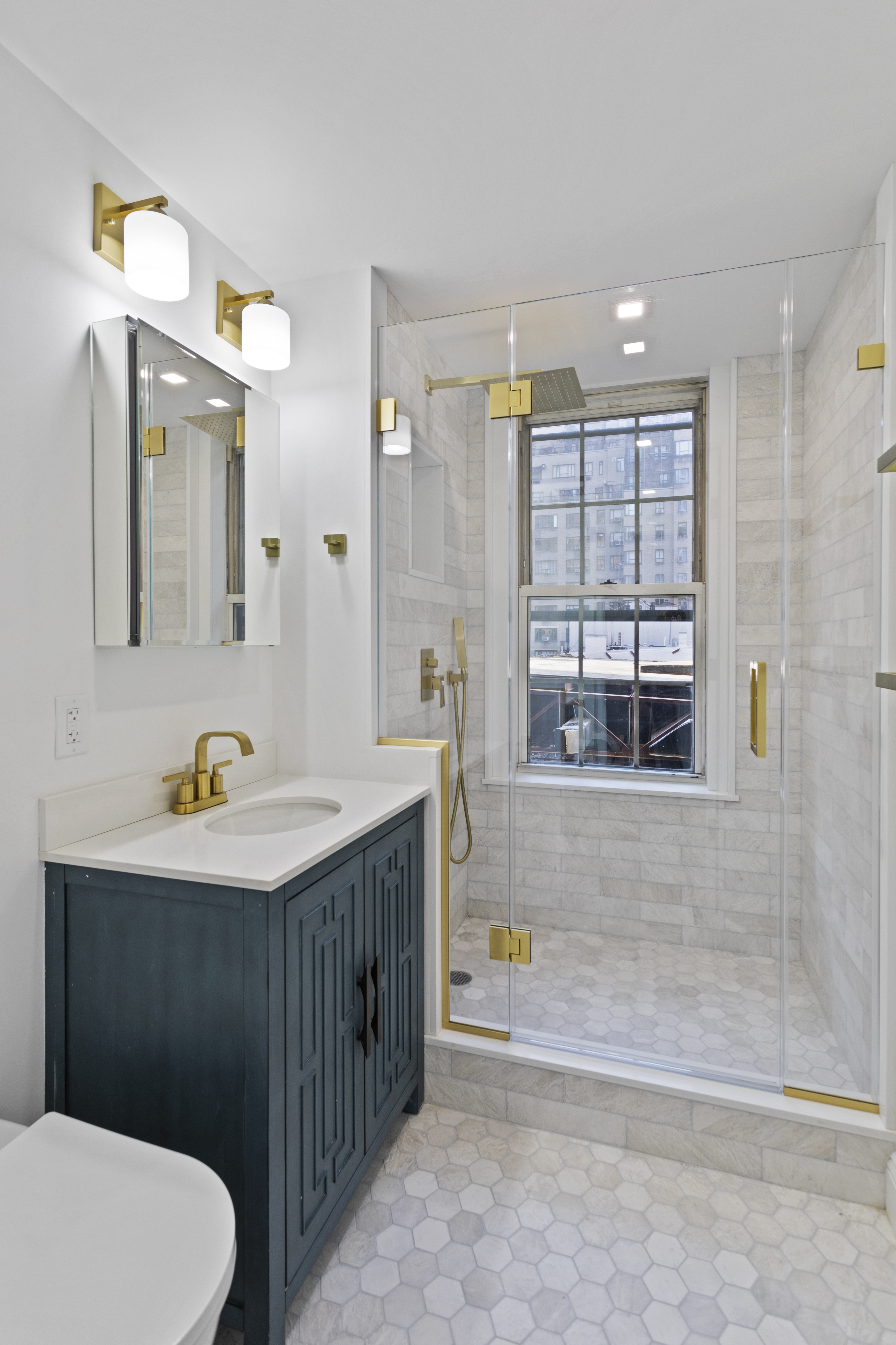 16 Park Avenue, Unit 6CD Manhattan, NY 10016 - Photo 3 of 12 a bathroom with a sink a toilet and shower