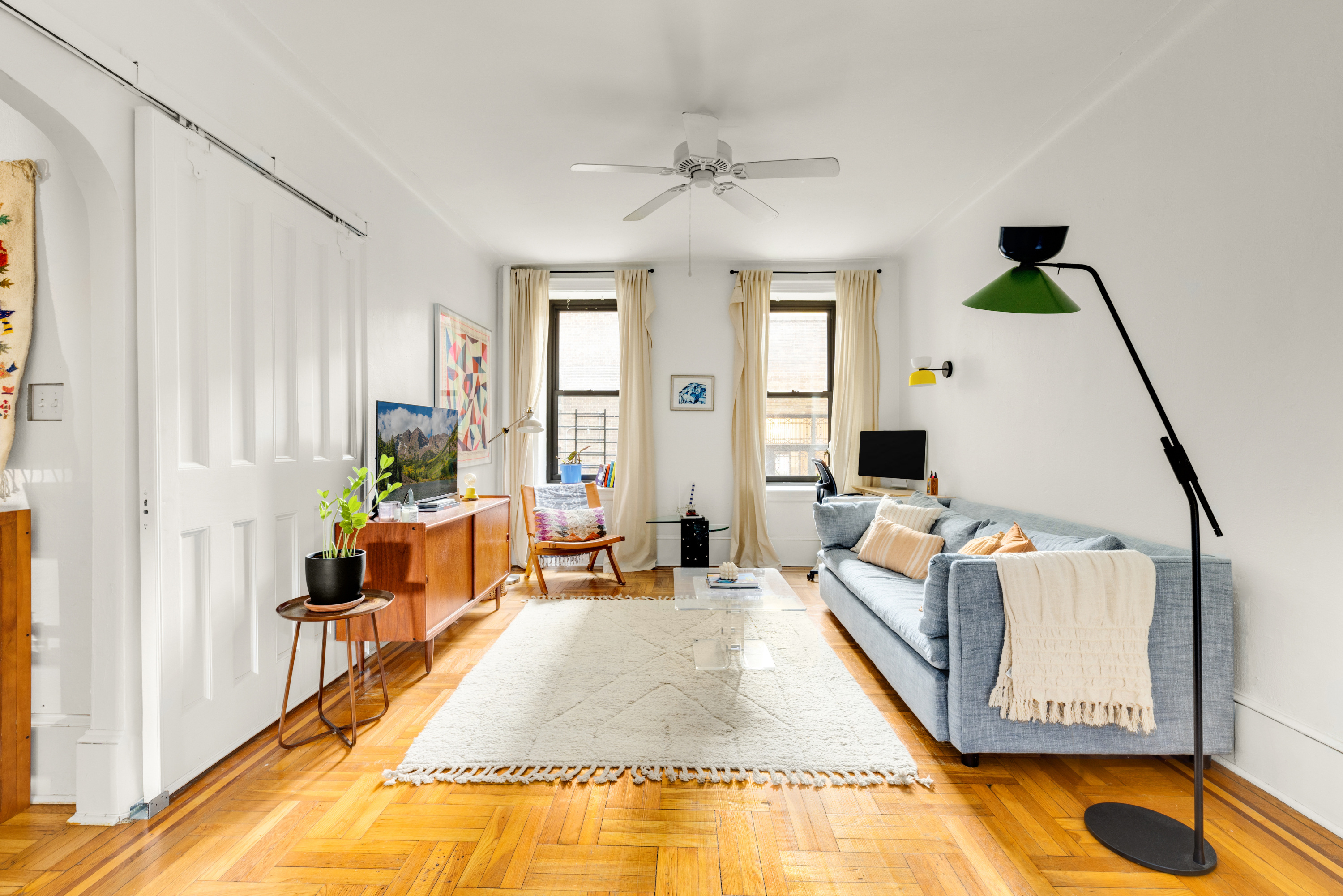 345 Montgomery Street, Unit 1N Brooklyn, NY 11225 - Photo 3 of 7 a living room with furniture and a flat screen tv