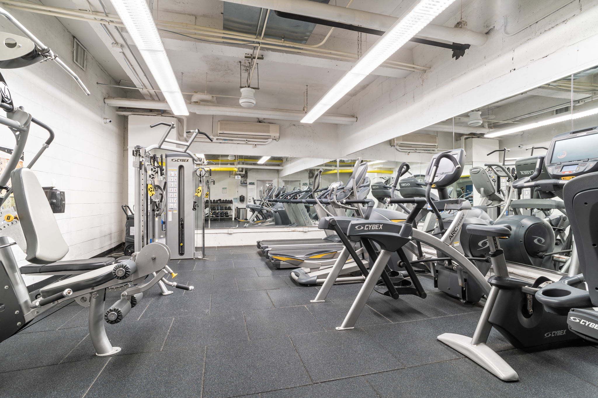 401 East 65th Street, Unit 12F Manhattan, NY 10065 - Photo 15 of 18 a view of a room with gym equipment