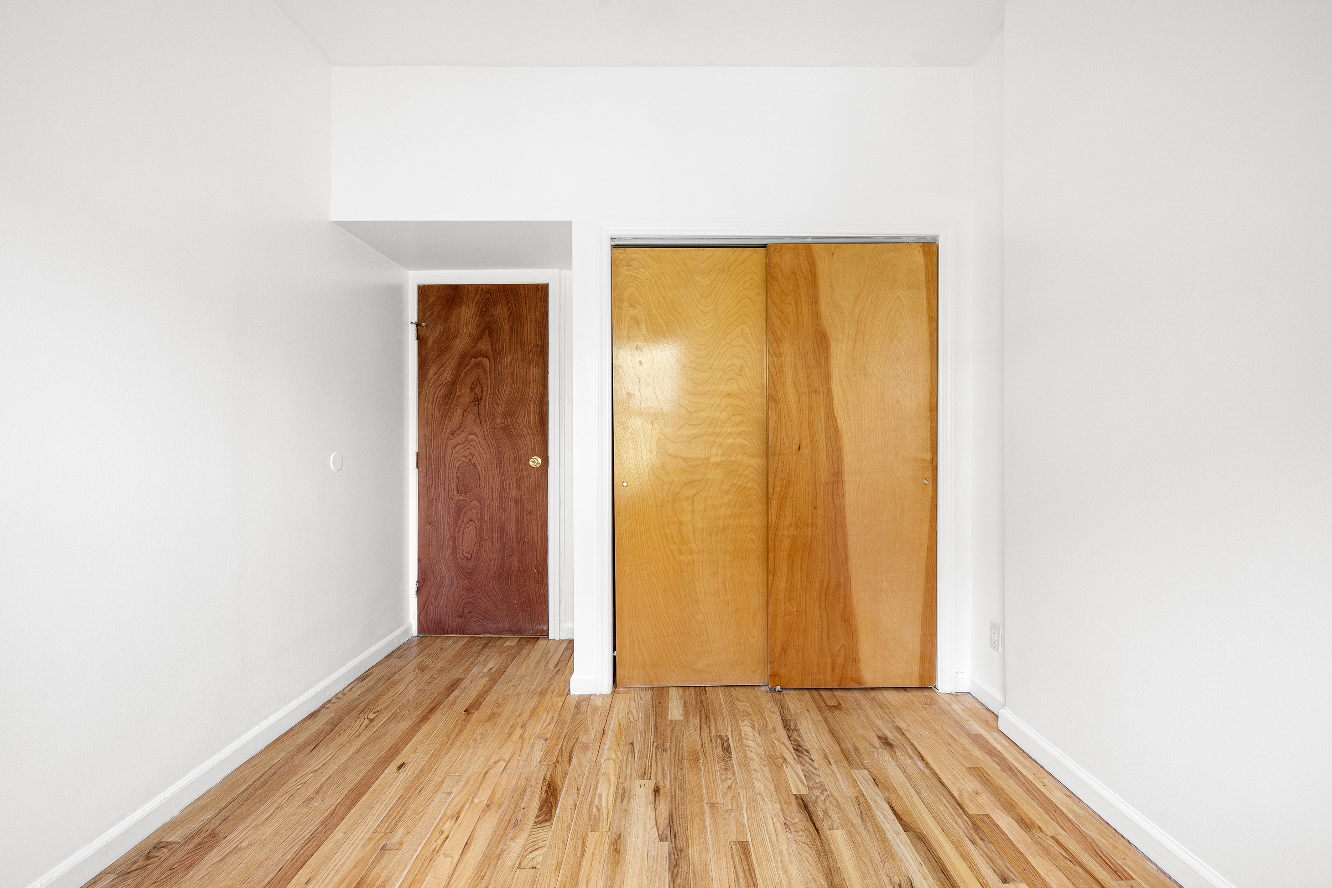 325 3rd Street, Unit 2A Brooklyn, NY 11215 - Photo 3 of 13 a view of a room with wooden floor and door