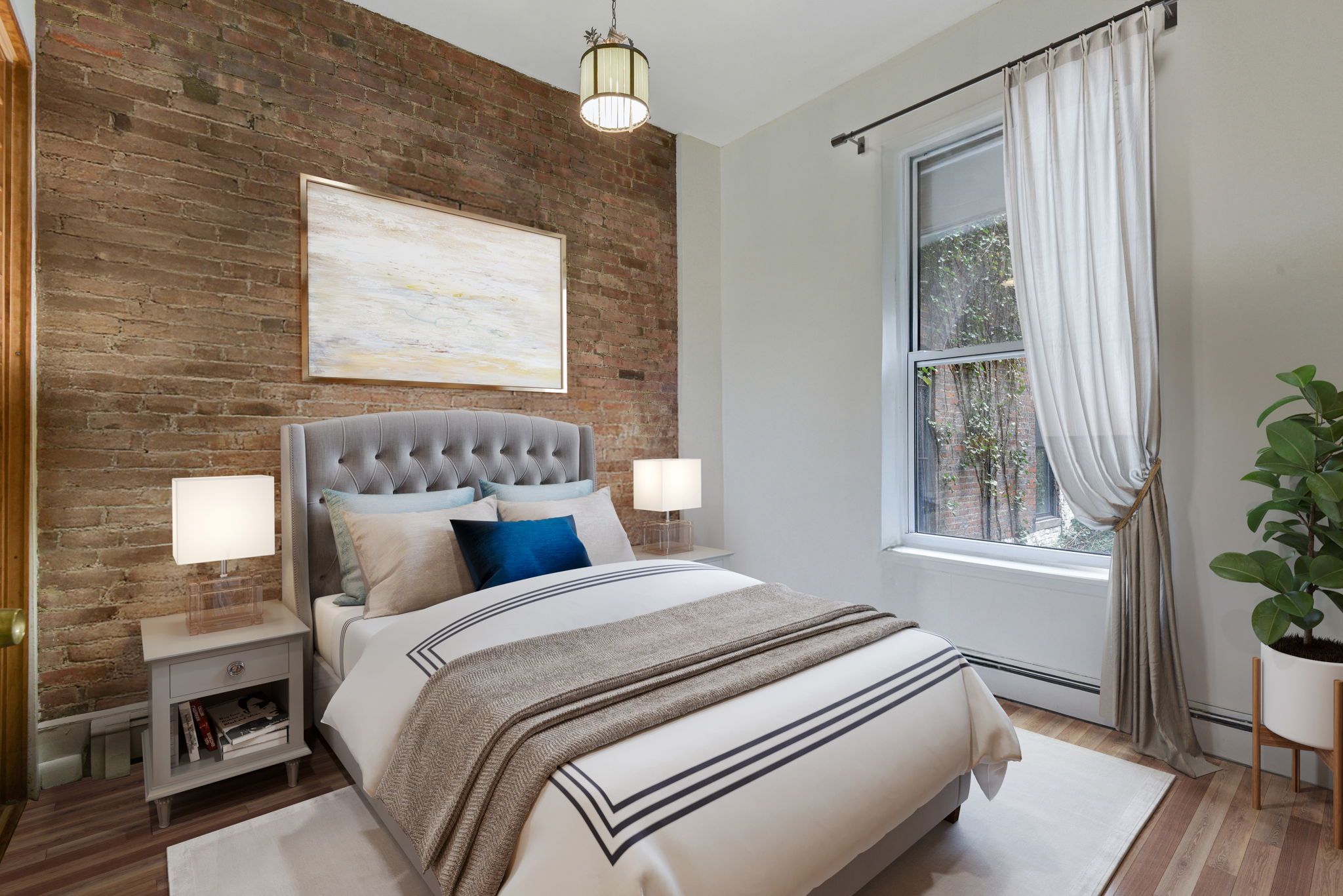 217 West 15th Street Manhattan, NY 10011 - Photo 16 of 21 a bedroom with bed and wooden floor