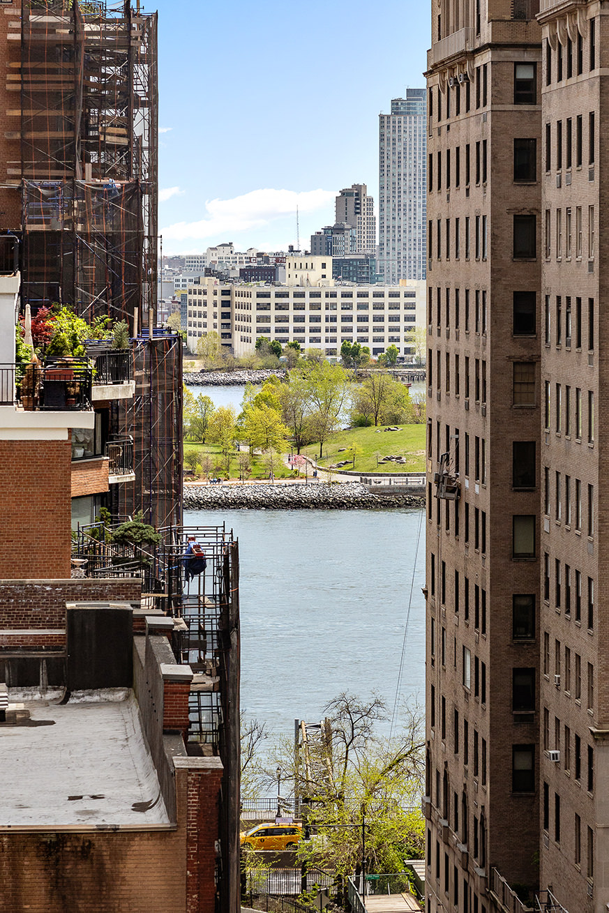 411 East 53rd Street, Unit 12D Manhattan, NY 10022 - Photo 13 of 15 a view of a balcony with two chairs and a table