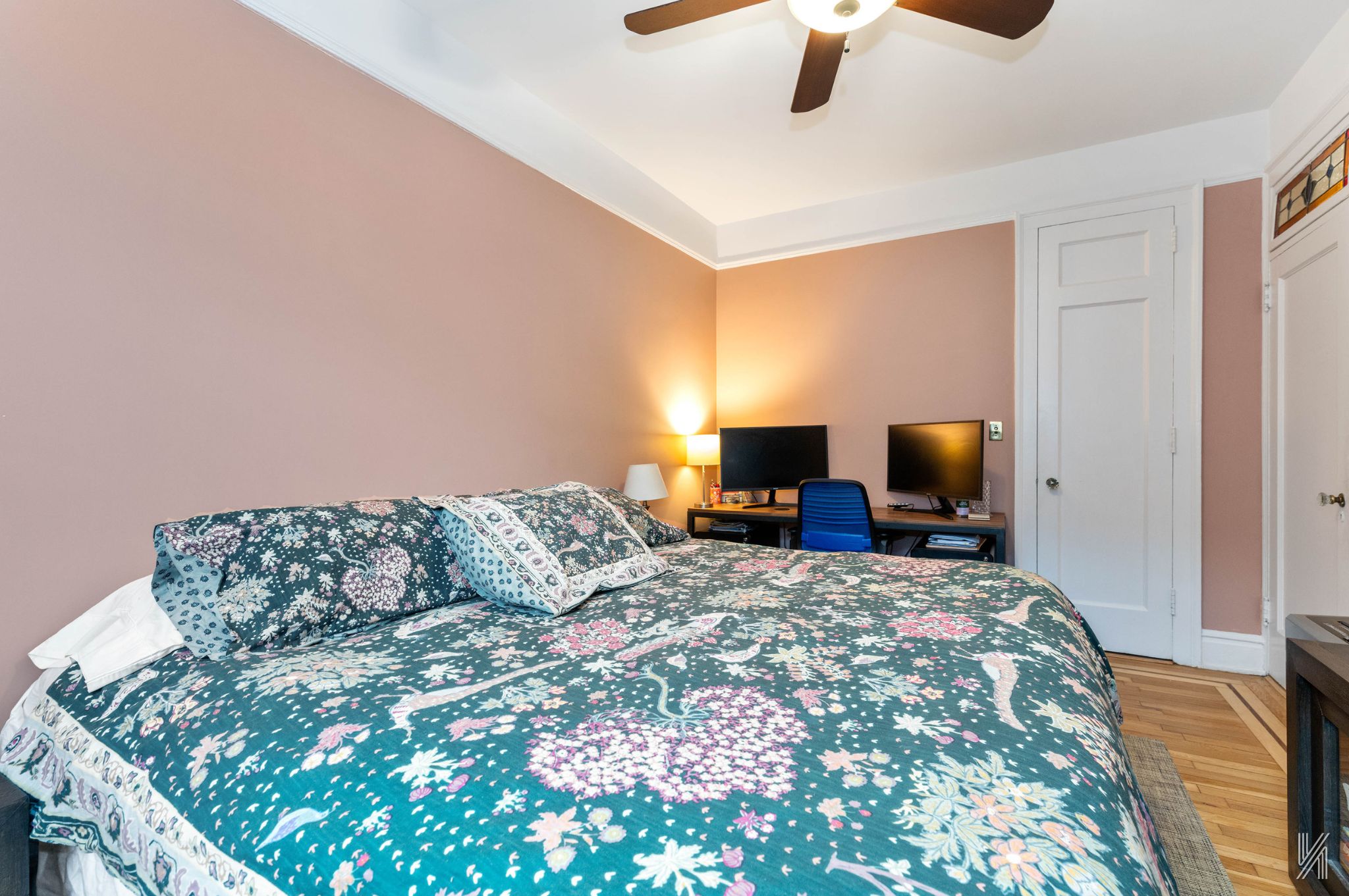 37-22 80th Street, Unit 31 Queens, NY 11372 - Photo 12 of 21 a bed sitting in a bedroom next to a window with tv on dresser