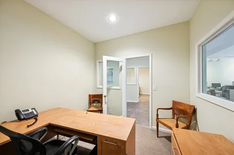 a view of a workspace with furniture