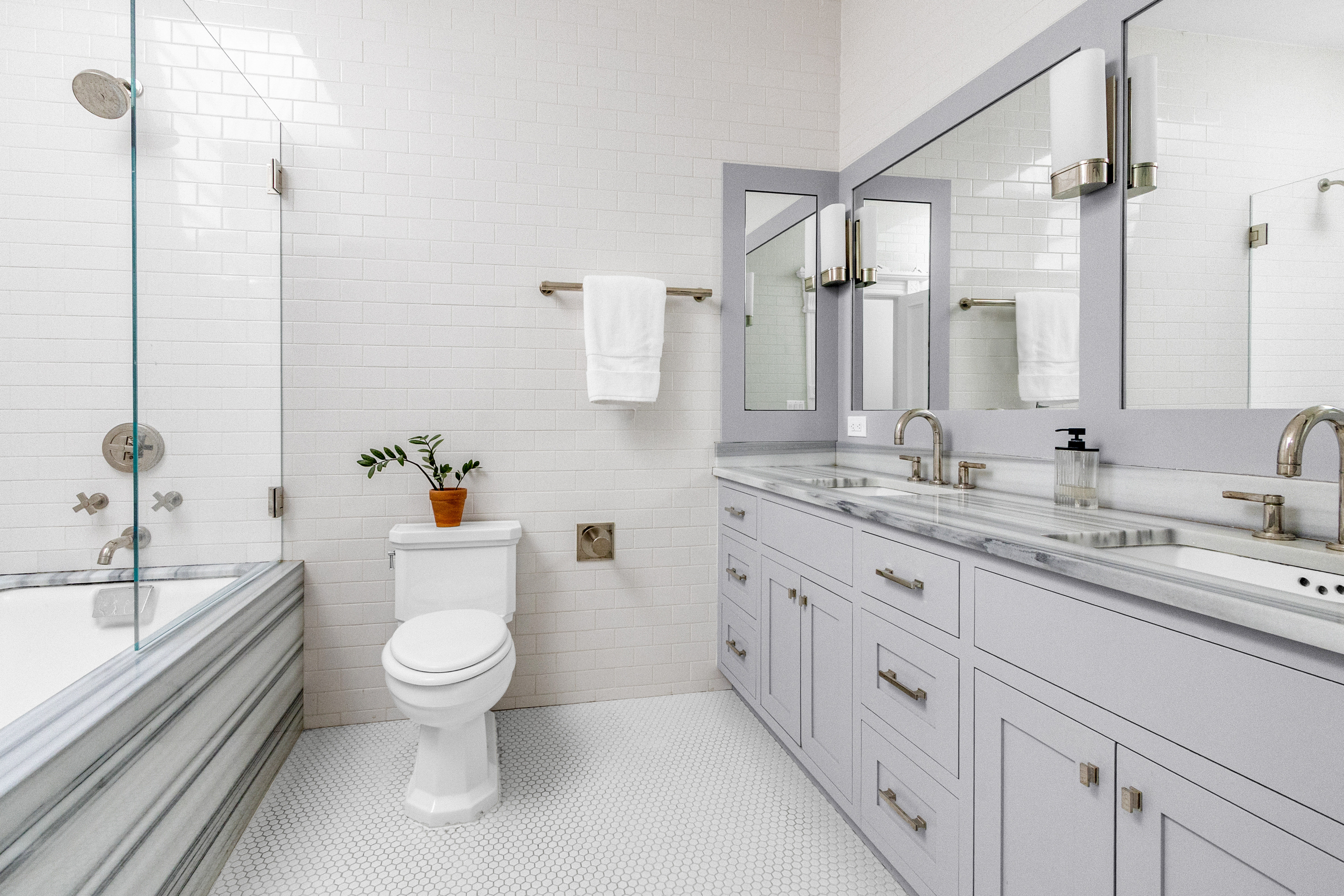 125 West 132nd Street Manhattan, NY 10027 - Photo 11 of 21 a bathroom with a granite countertop toilet sink and mirror