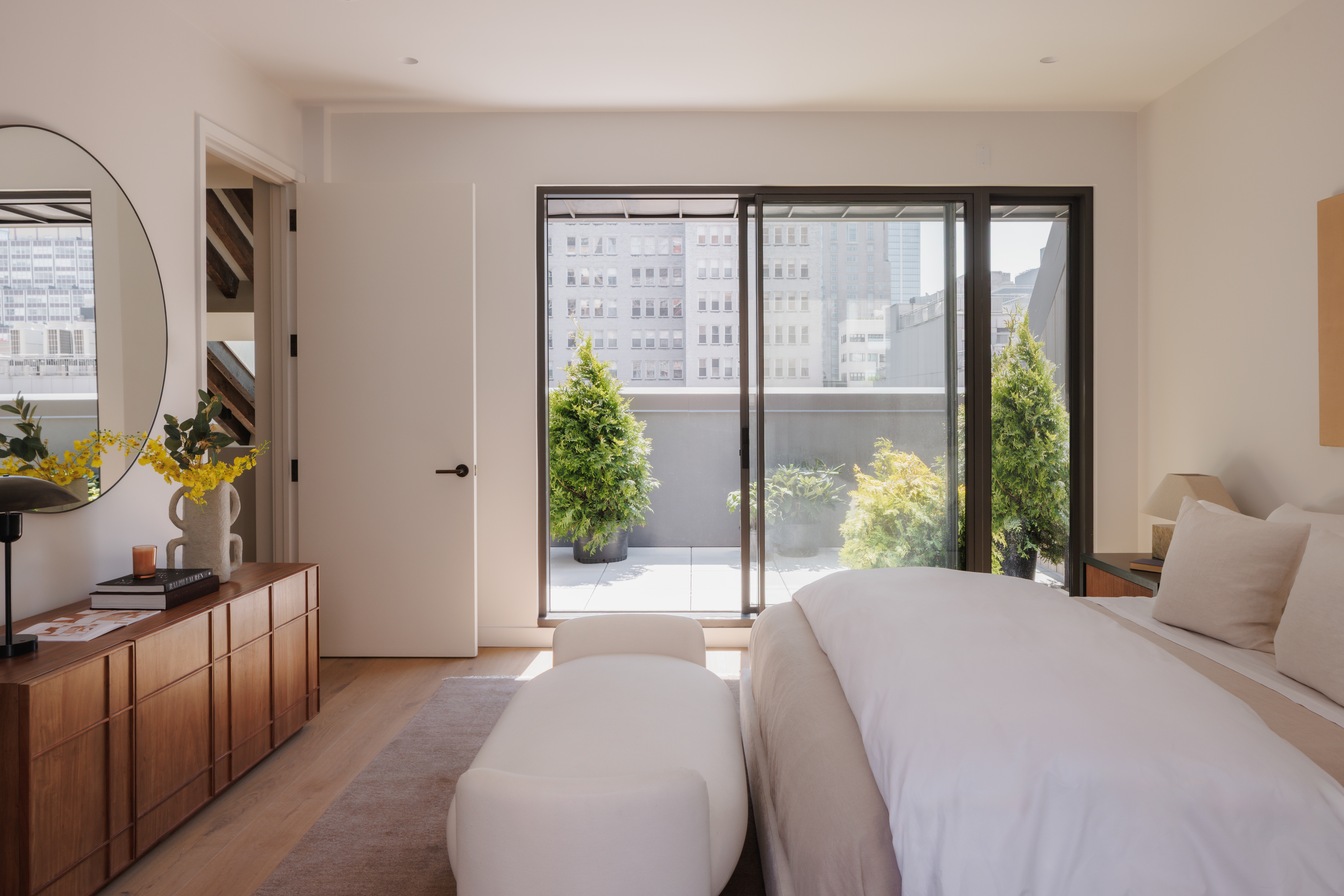 62 Reade Street, Unit PH Manhattan, NY 10007 - Photo 9 of 14 a bedroom with a bed and a flat tv screen