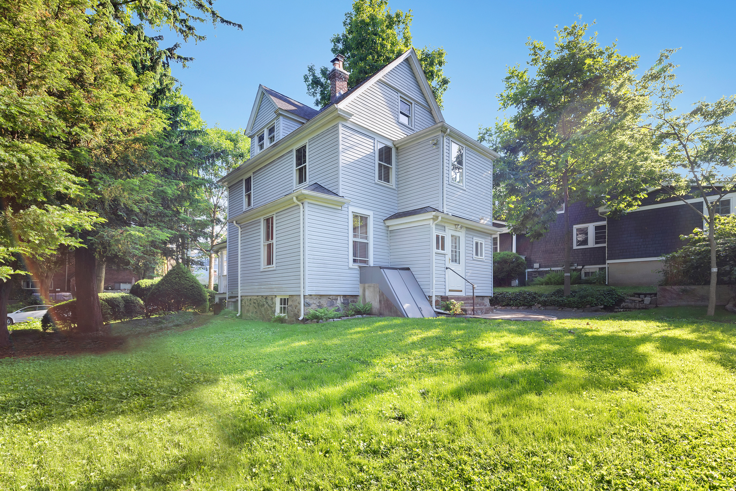 242-09 Pine Street Queens, NY 11363 - Photo 16 of 21 a view of a yard with a house