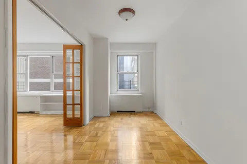 a view of an empty room with a window