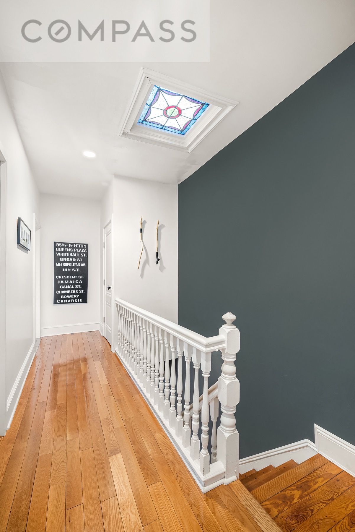 69 Sterling Street Brooklyn, NY 11225 - Photo 10 of 14 a view of a hallway with wooden floor