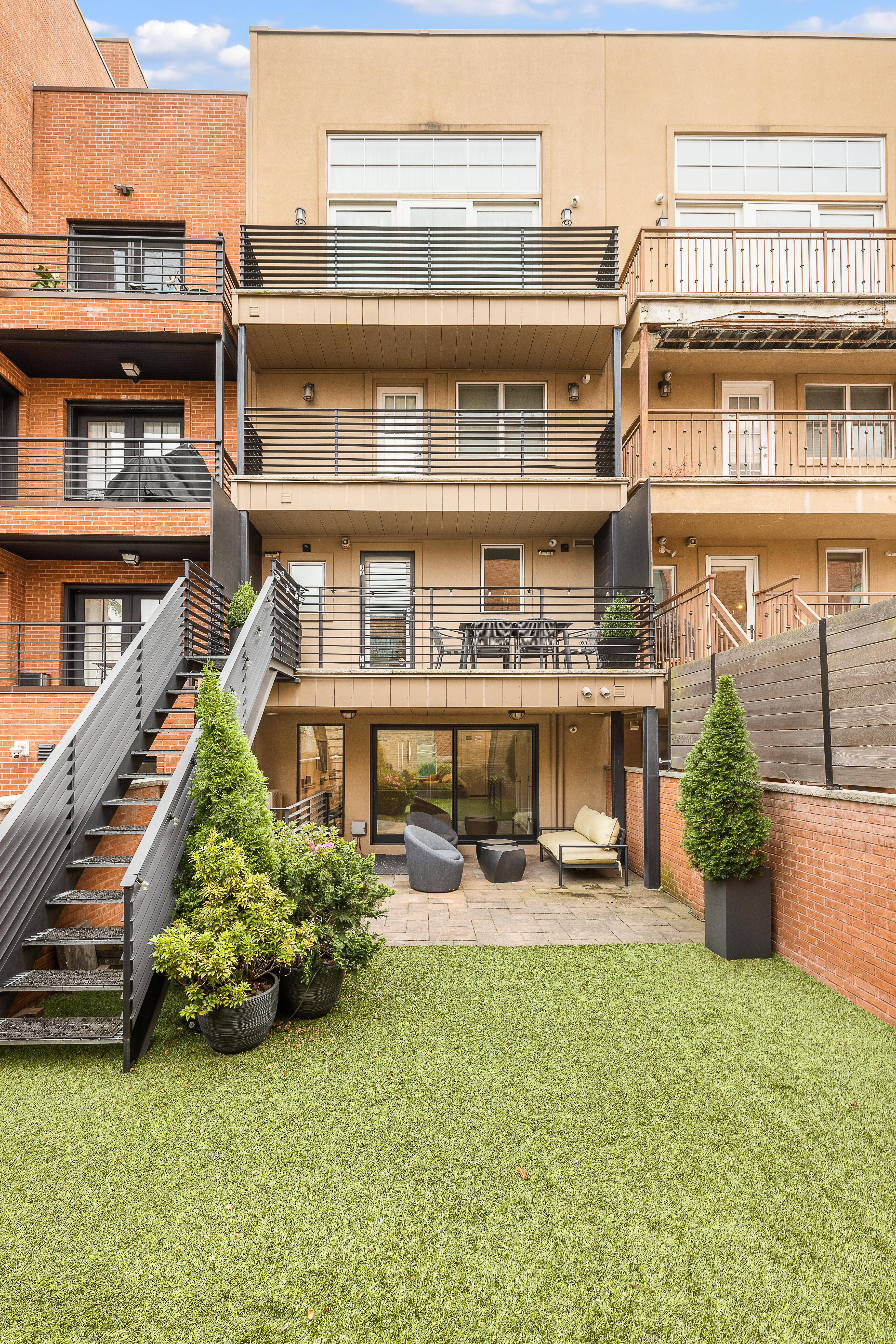 330 Bond Street Brooklyn, NY 11231 - Photo 15 of 18 a view of a building with a big yard and potted plants