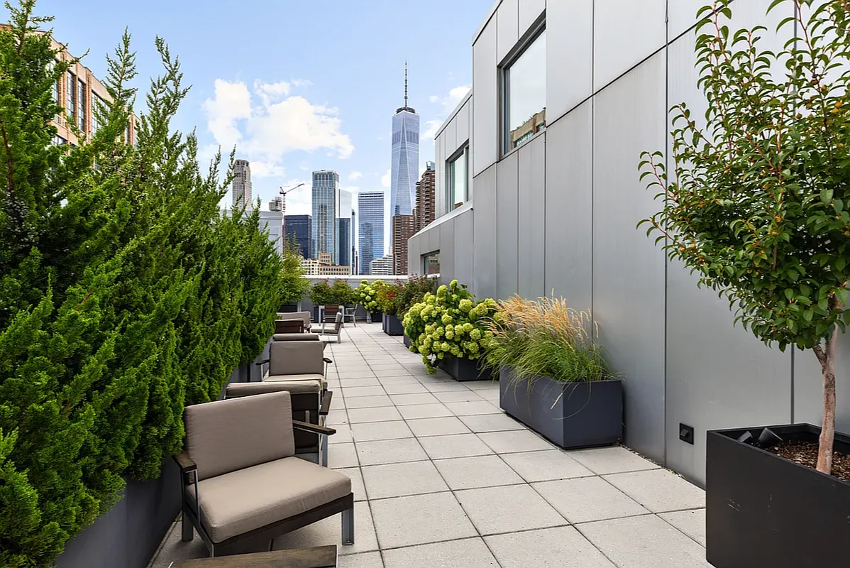 415 Greenwich Street, Unit 5D Manhattan, NY 10013 - Photo 14 of 16 a view of a chairs and table in a backyard