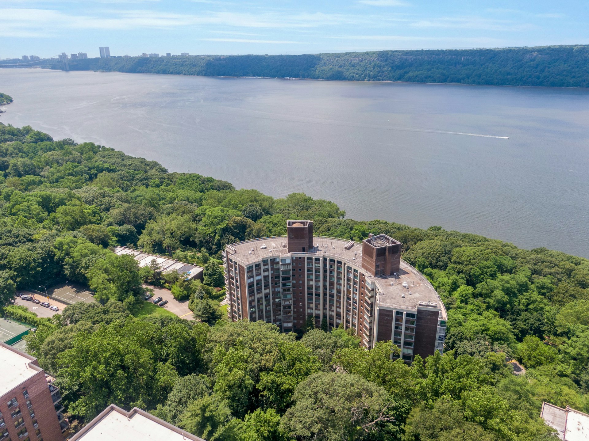4455 Douglas Avenue, Unit 3FE Bronx, NY 10471 - Photo 47 of 53 a view of a house with a yard and lake view