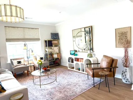 a living room with furniture and a table