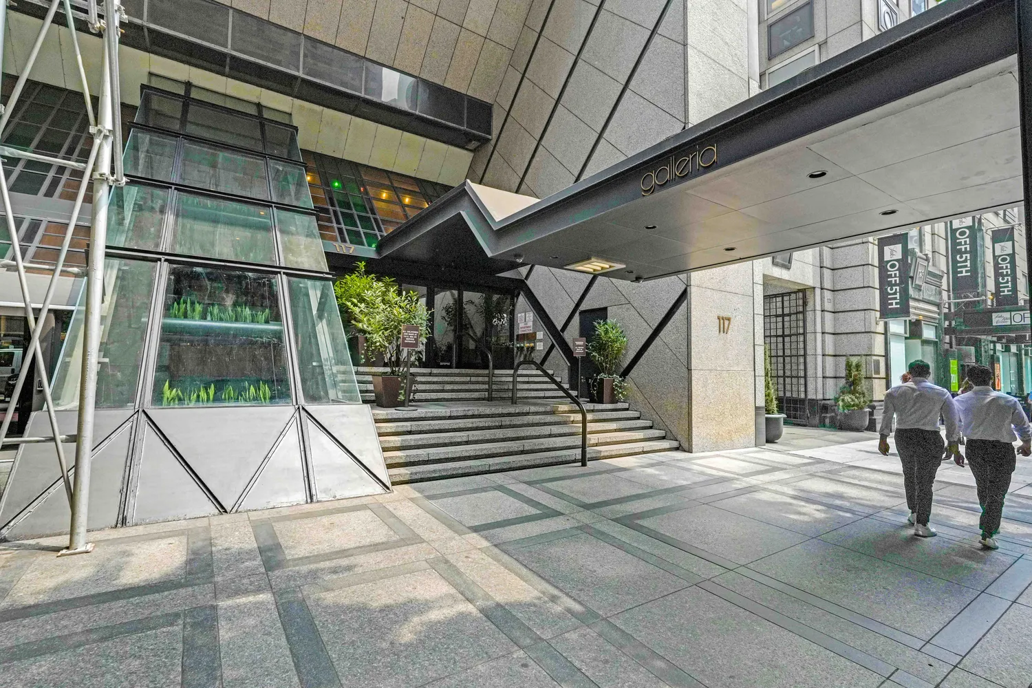 a living room with furniture wooden floor and a fireplace
