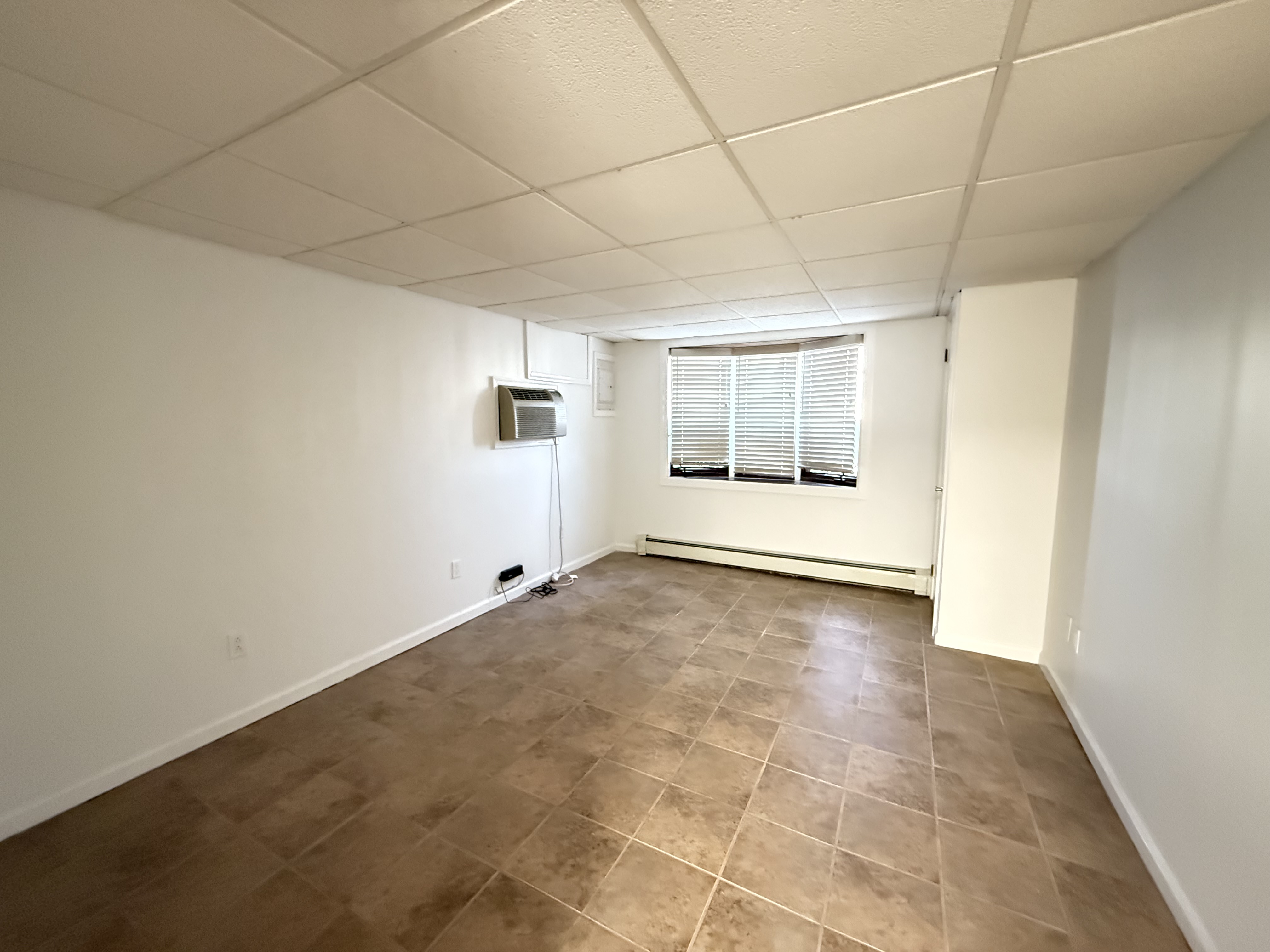 3236 Country Club Road Bronx, NY 10465 - Photo 21 of 22 a view of an empty room with a window