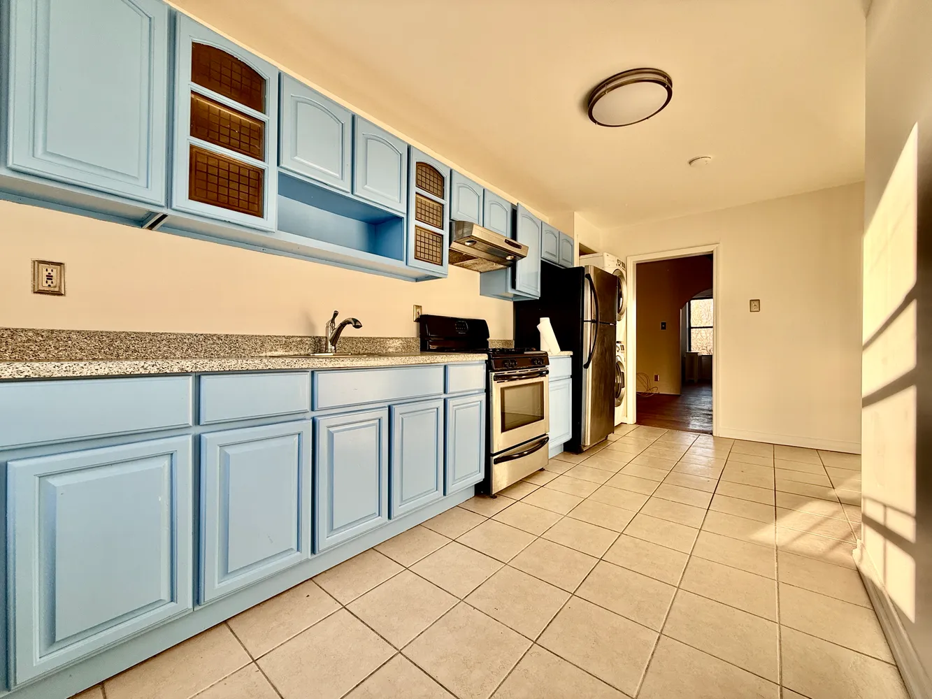 a kitchen with stainless steel appliances granite countertop a sink and cabinets