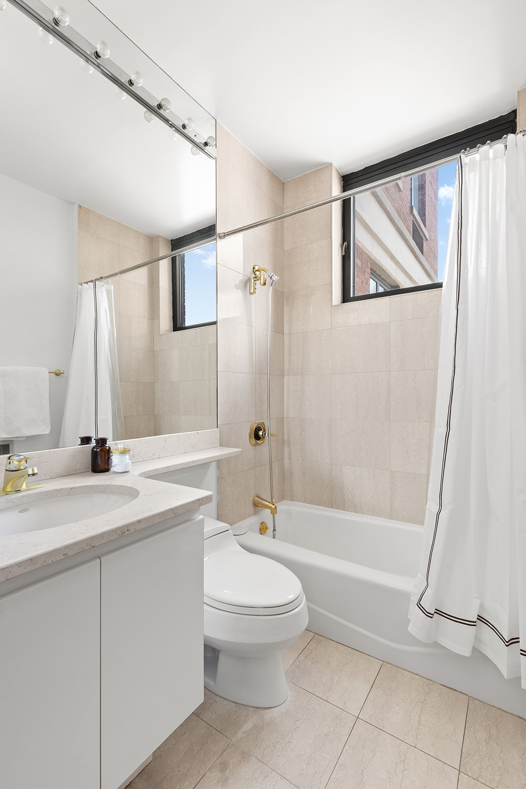 222 Riverside Drive, Unit PH2D Manhattan, NY 10025 - Photo 10 of 11 a bathroom with a granite countertop sink a toilet and shower