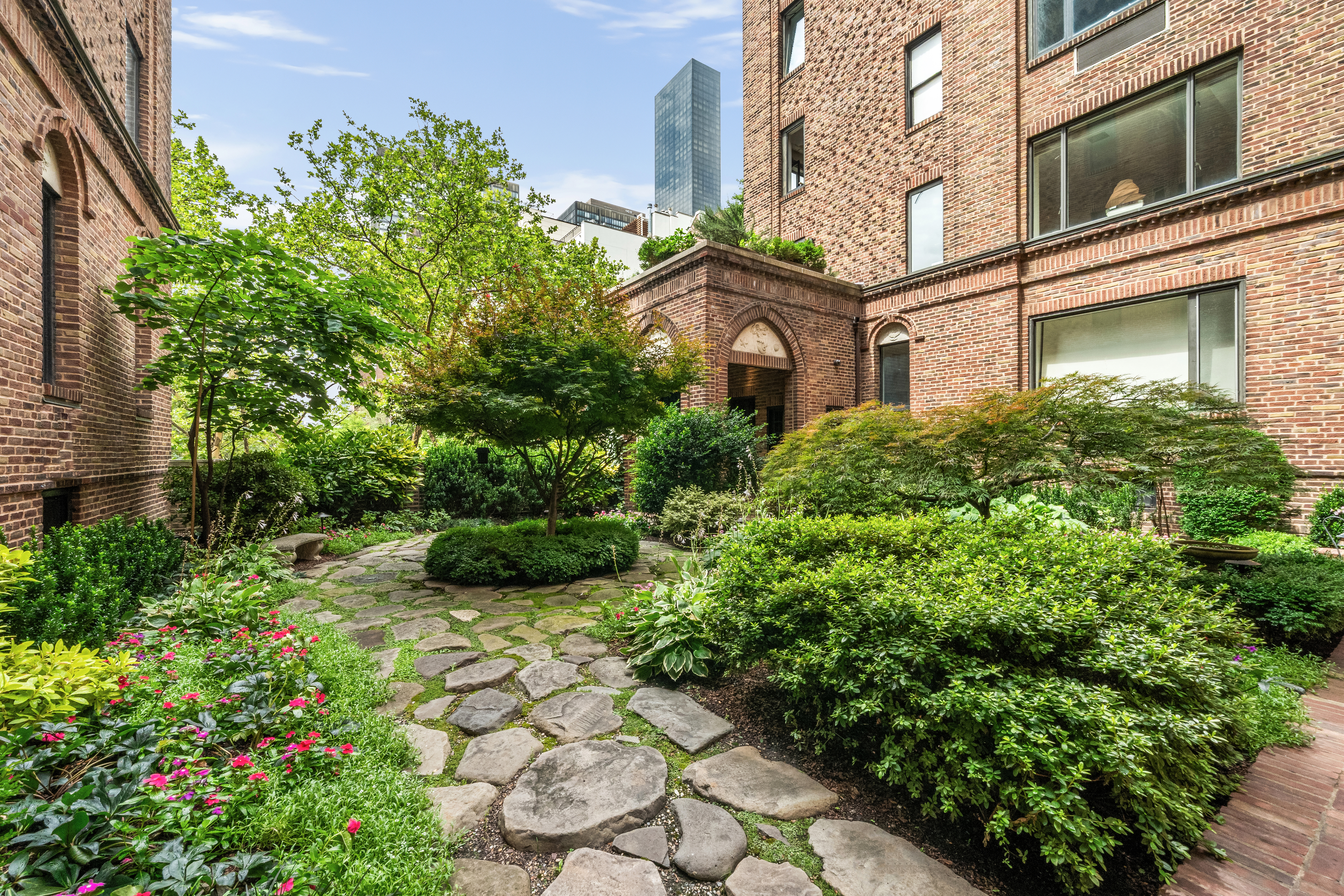 455 East 51st Street, Unit 2F Manhattan, NY 10022 - Photo 15 of 17 a view of a garden with plants