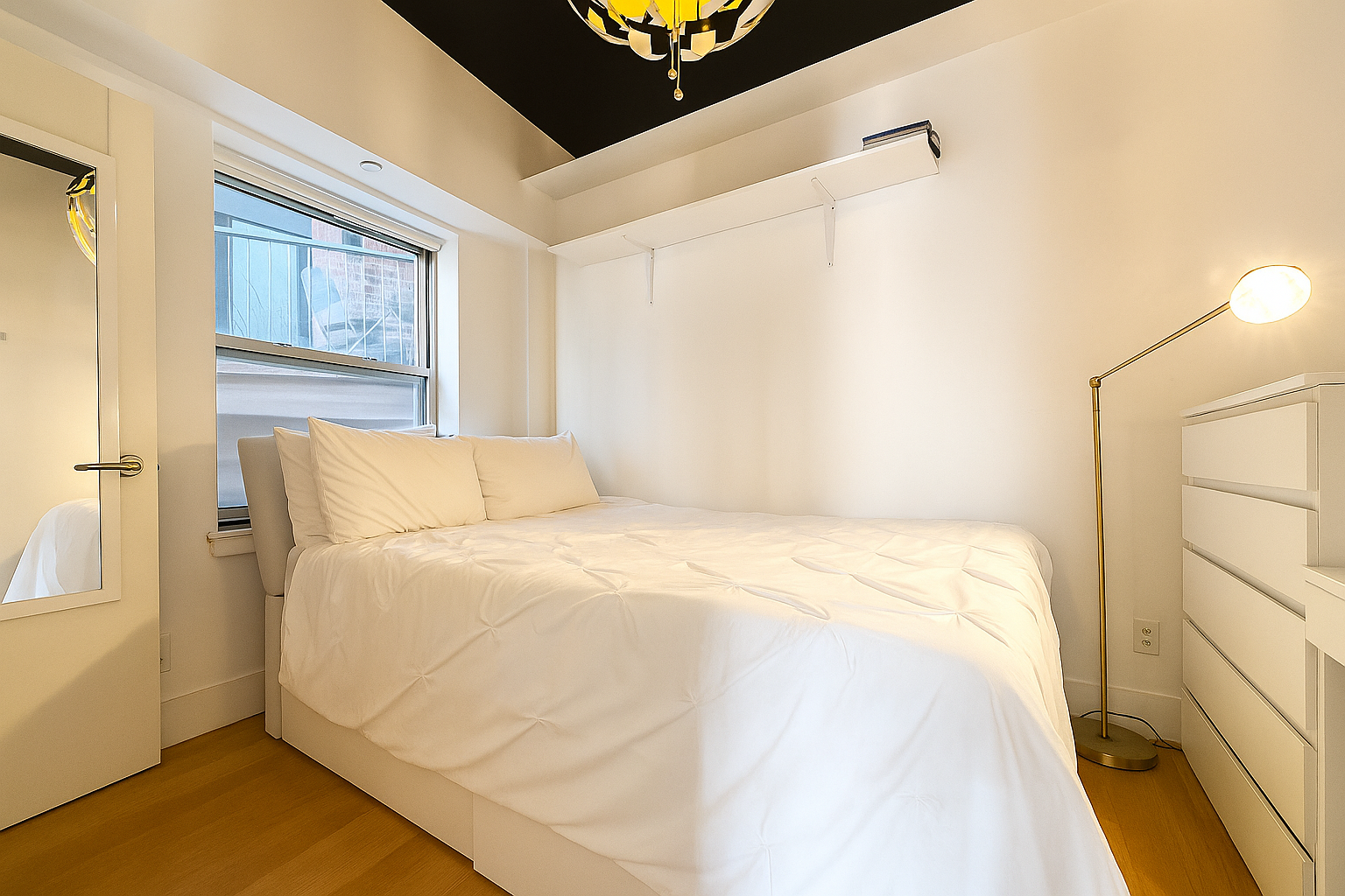 29 South 3rd Street, Unit 2A Brooklyn, NY 11249 - Photo 8 of 17 a large bed sitting in a bedroom next to a window