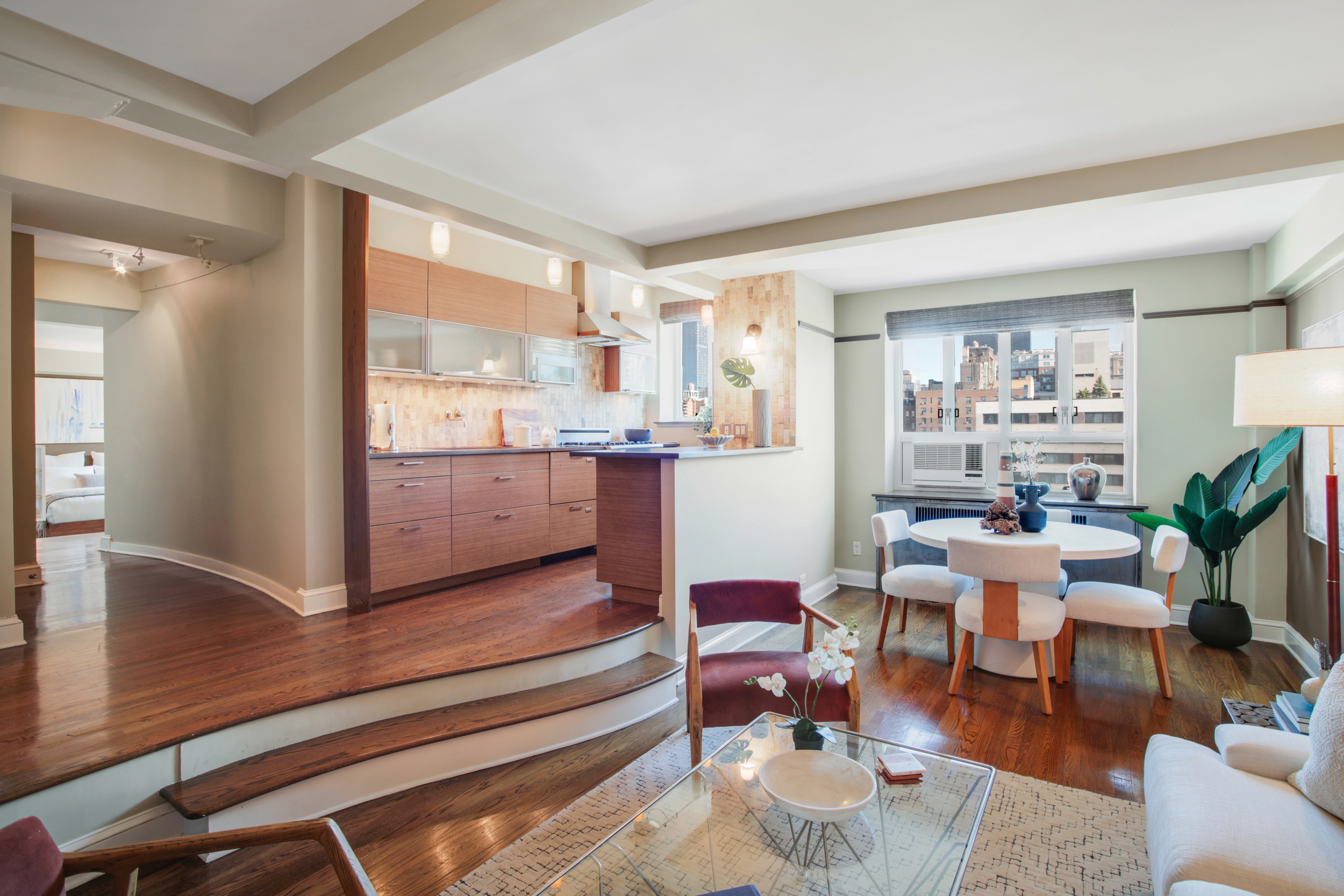 200 West 20th Street, Unit 1409/10 Manhattan, NY 10011 - Photo 1 of 15 a living room with furniture and a large window