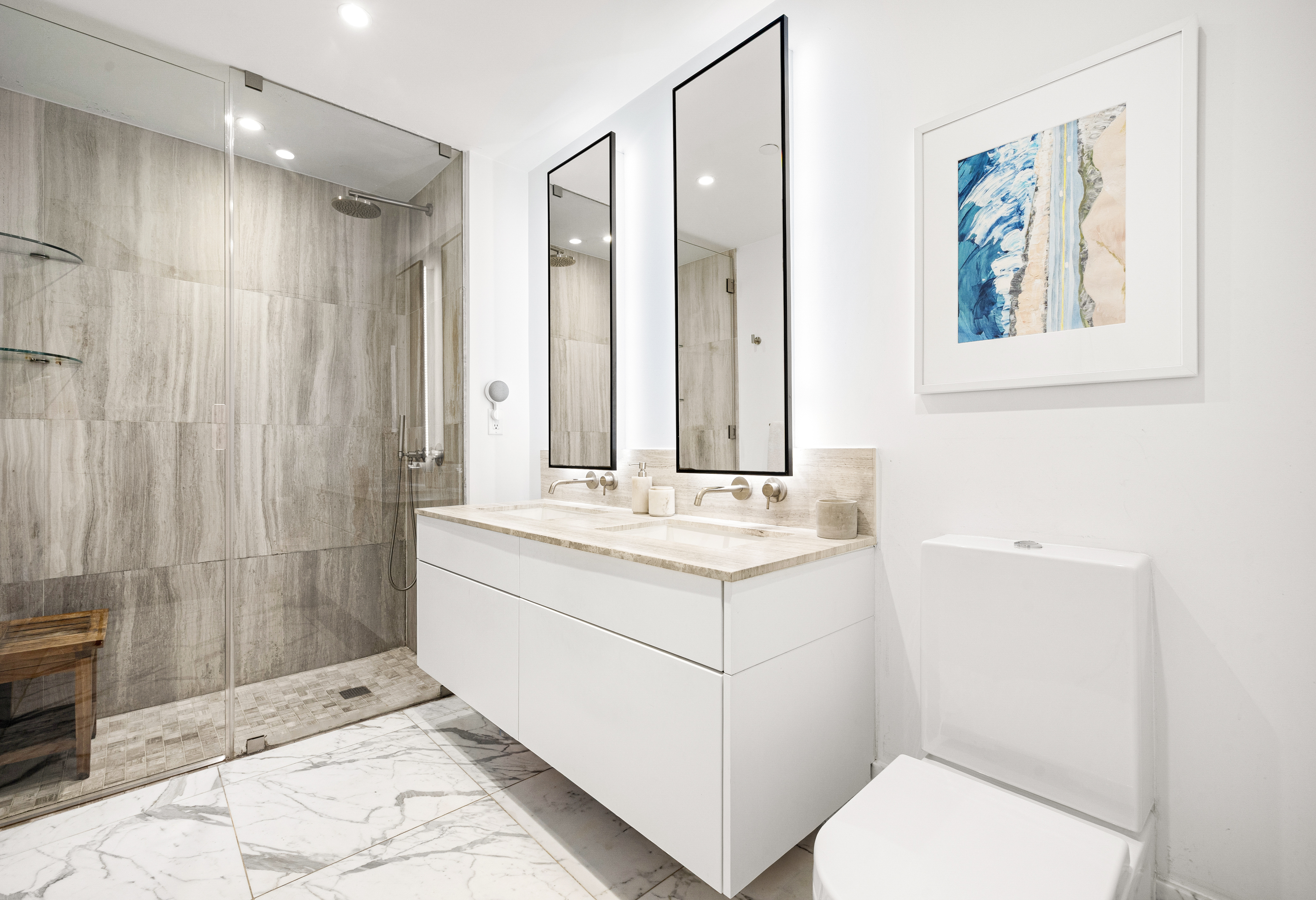 429 Kent Avenue, Unit 340 Brooklyn, NY 11249 - Photo 5 of 9 a bathroom with a sink a toilet and shower