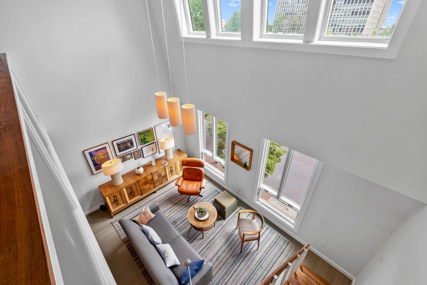a view of a livingroom with furniture and a flat screen tv