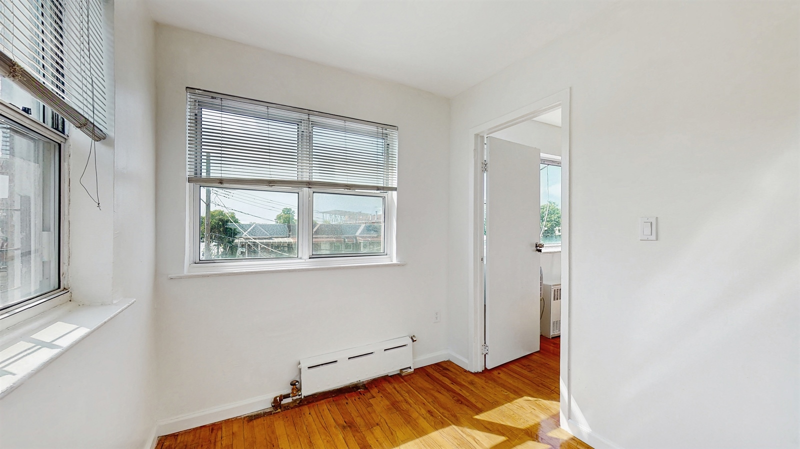 295 Conklin Avenue, Unit 3 Brooklyn, NY 11236 - Photo 6 of 15 a view of room with window and hallway