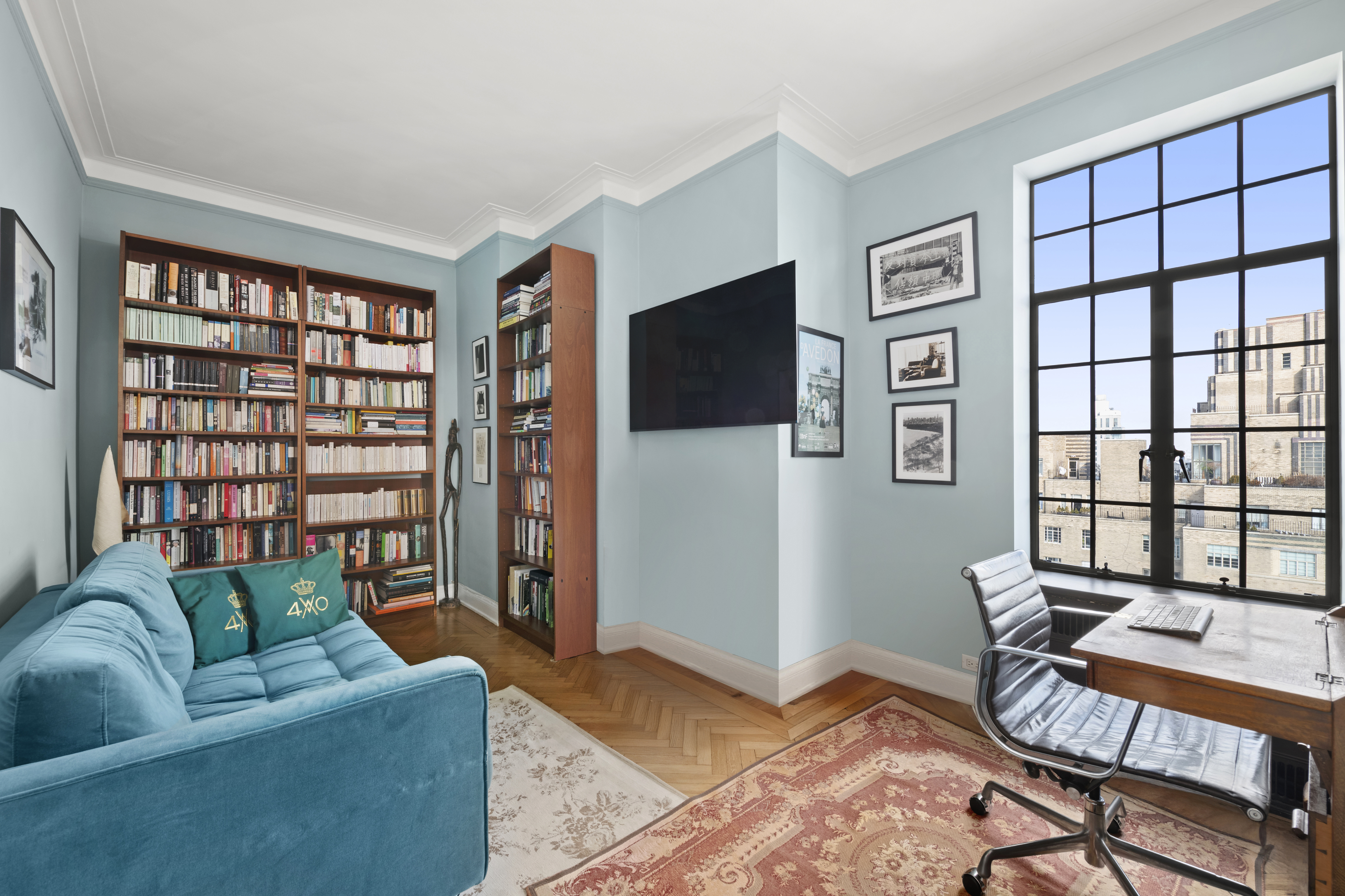 300 Central Park West, Unit 21G Manhattan, NY 10024 - Photo 8 of 21 a living room with furniture and a flat screen tv