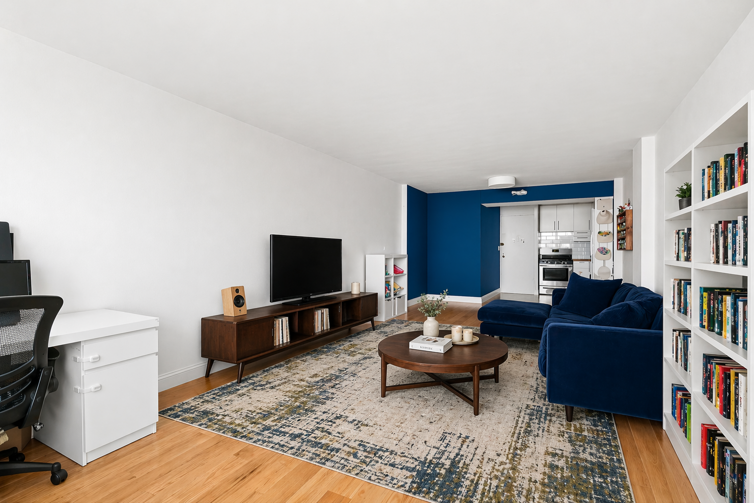 1655 Flatbush Avenue, Unit C1909 Brooklyn, NY 11210 - Photo 2 of 7 a living room with furniture and a flat screen tv