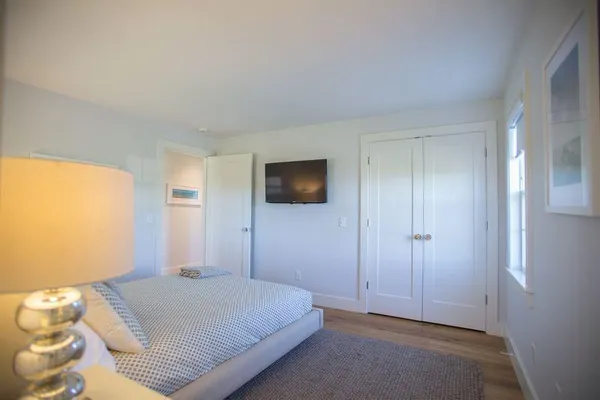 a bedroom with a bed and a couch