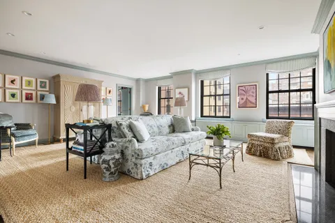 a living room with furniture dining area and a window