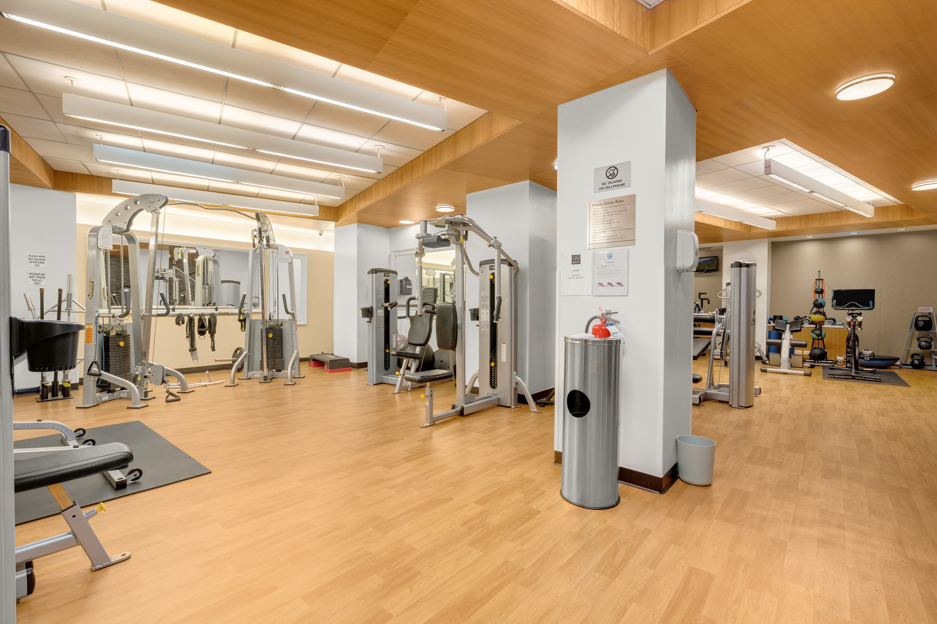 99 John Street, Unit 922 Manhattan, NY 10038 - Photo 11 of 14 a view of a livingroom with gym equipment