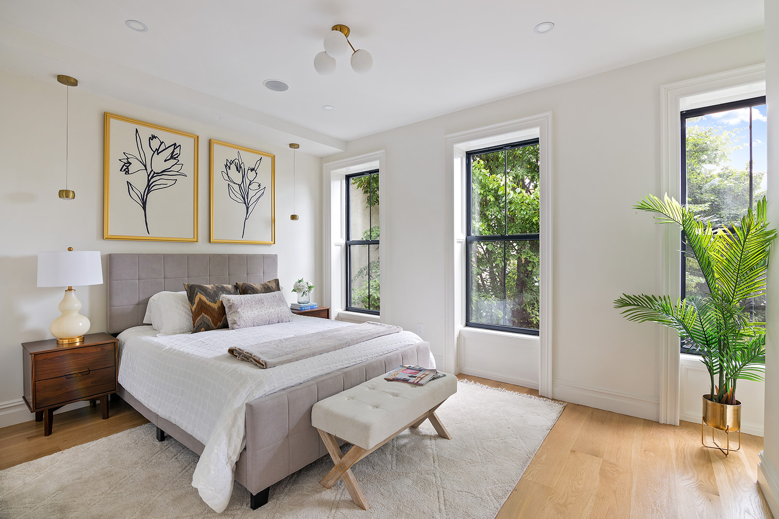 371 Herkimer Street Brooklyn, NY 11213 - Photo 7 of 16 a bedroom with a large bed and a potted plant