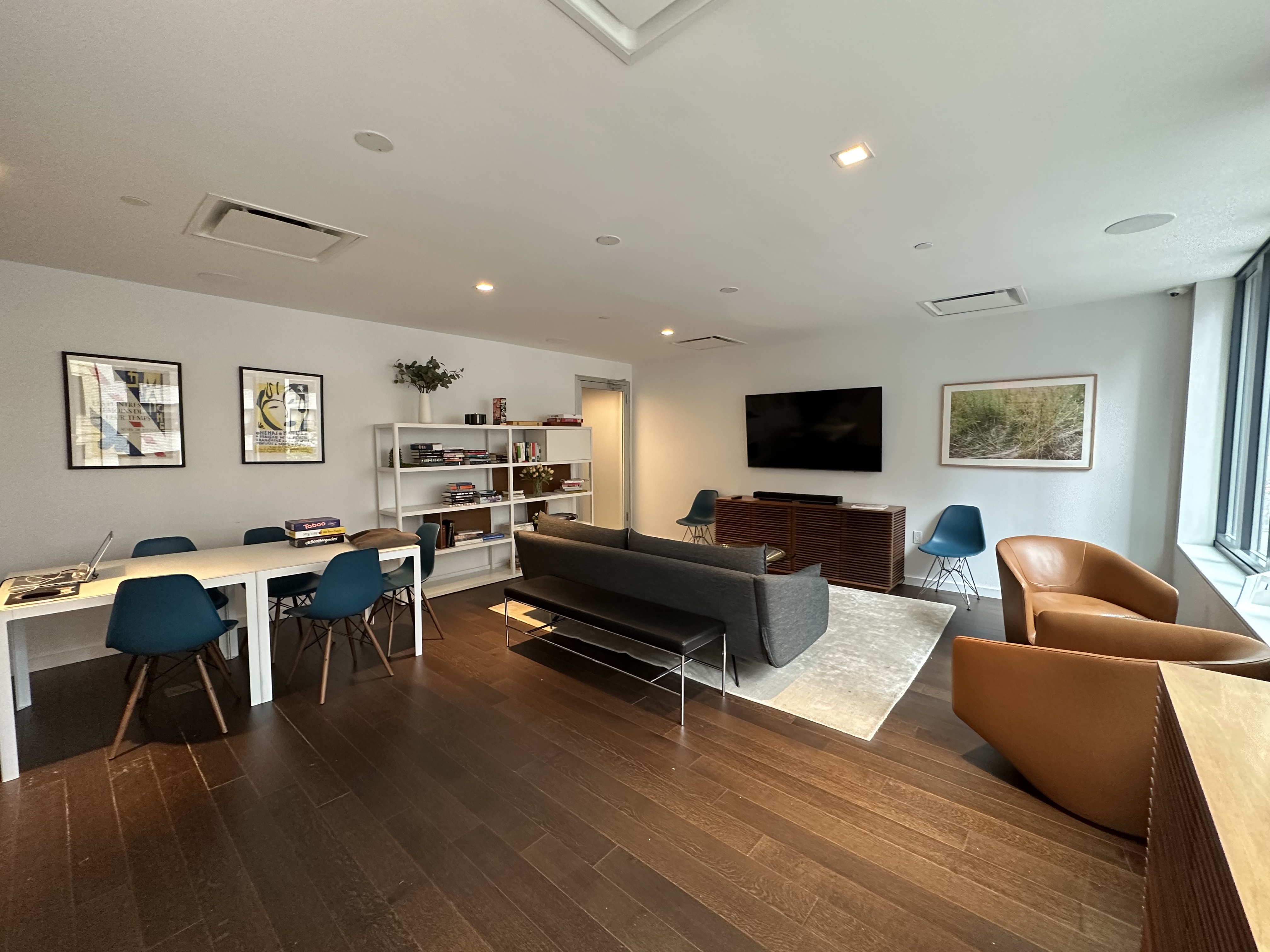 591 3rd Avenue, Unit 9C Manhattan, NY 10016 - Photo 12 of 13 a living room with furniture and a flat screen tv