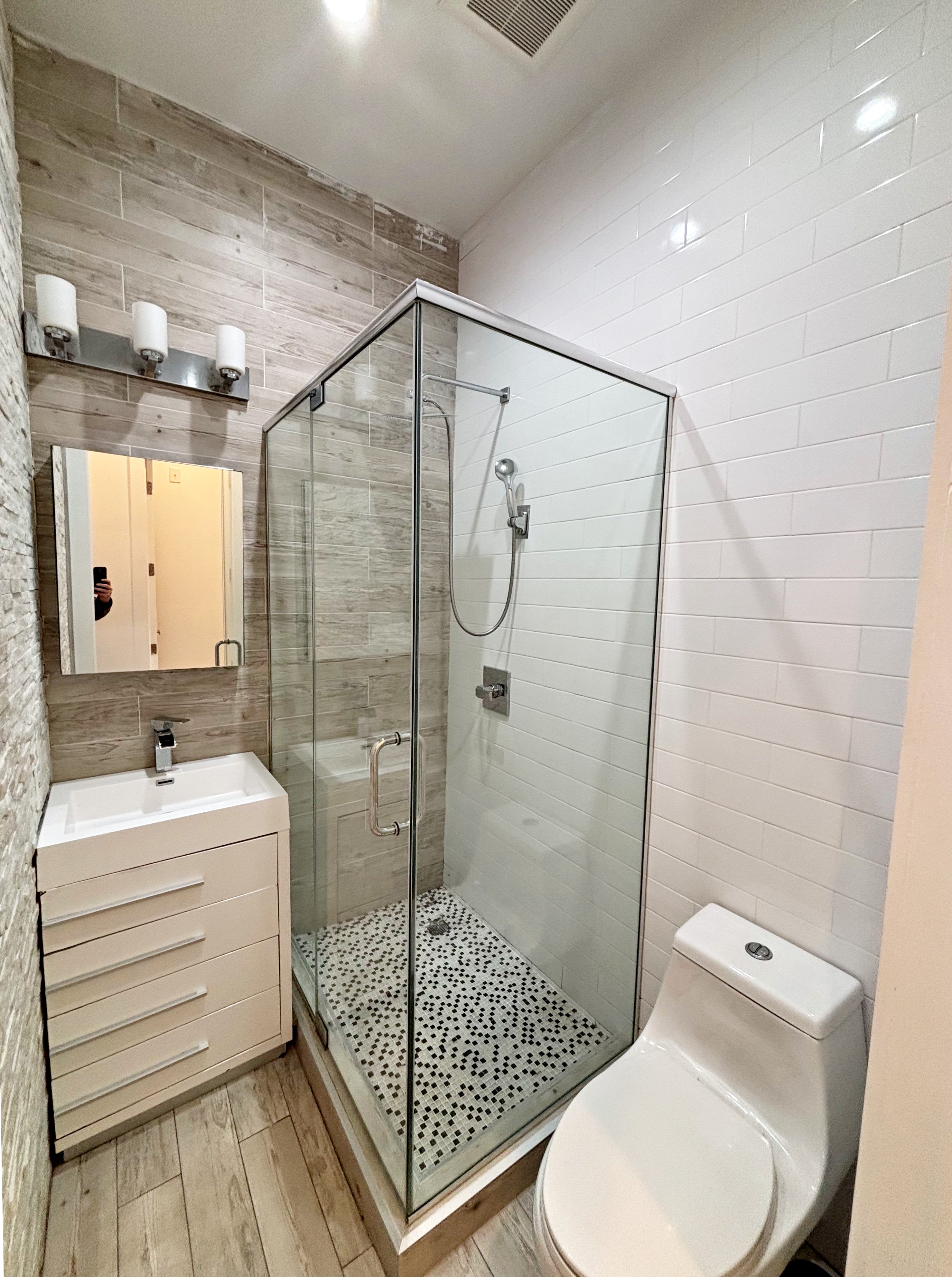 385 Nostrand Avenue, Unit Undisclosed Brooklyn, NY 11216 - Photo 21 of 27 a bathroom with a sink toilet and shower