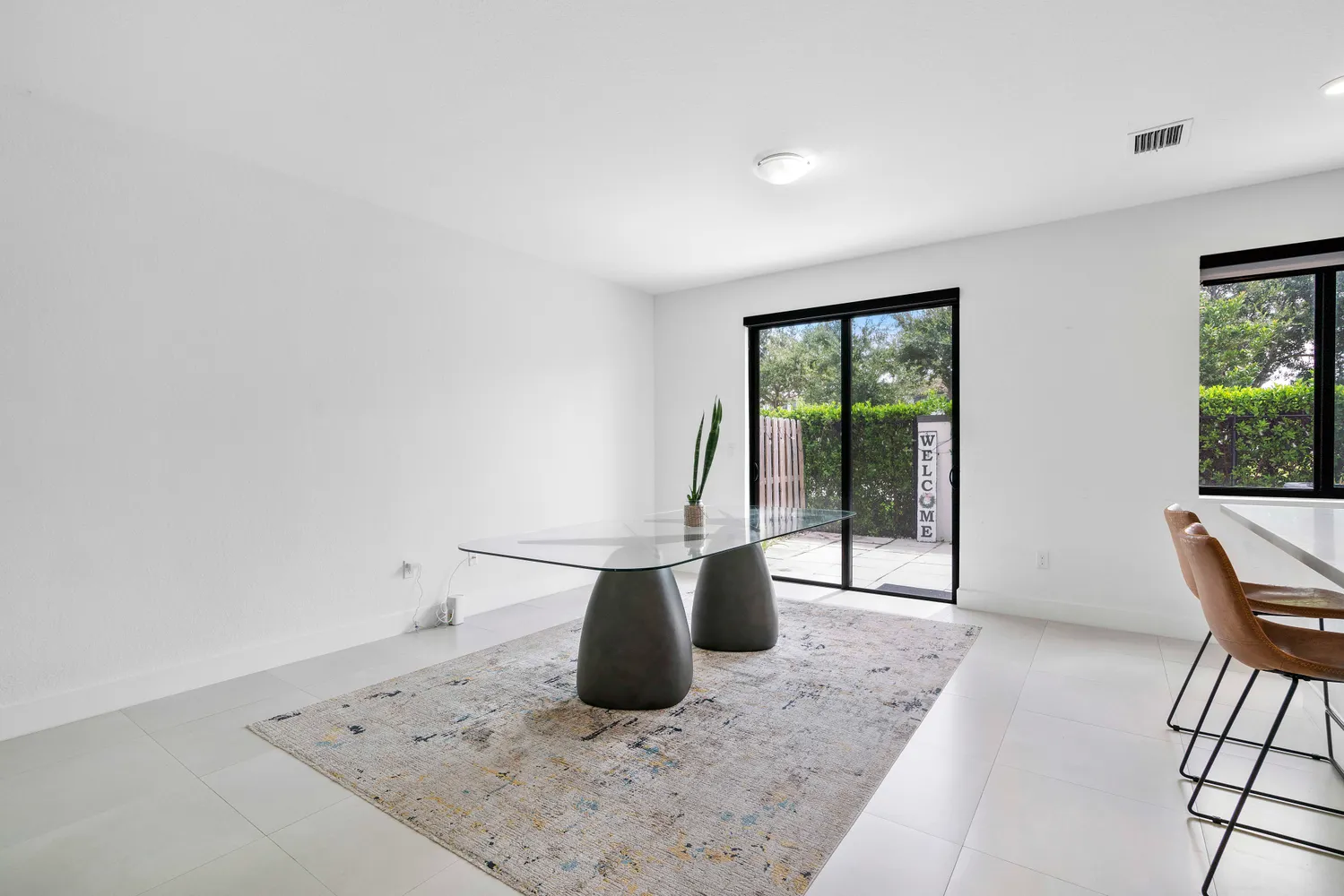 a view of a kitchen with a sink and a window