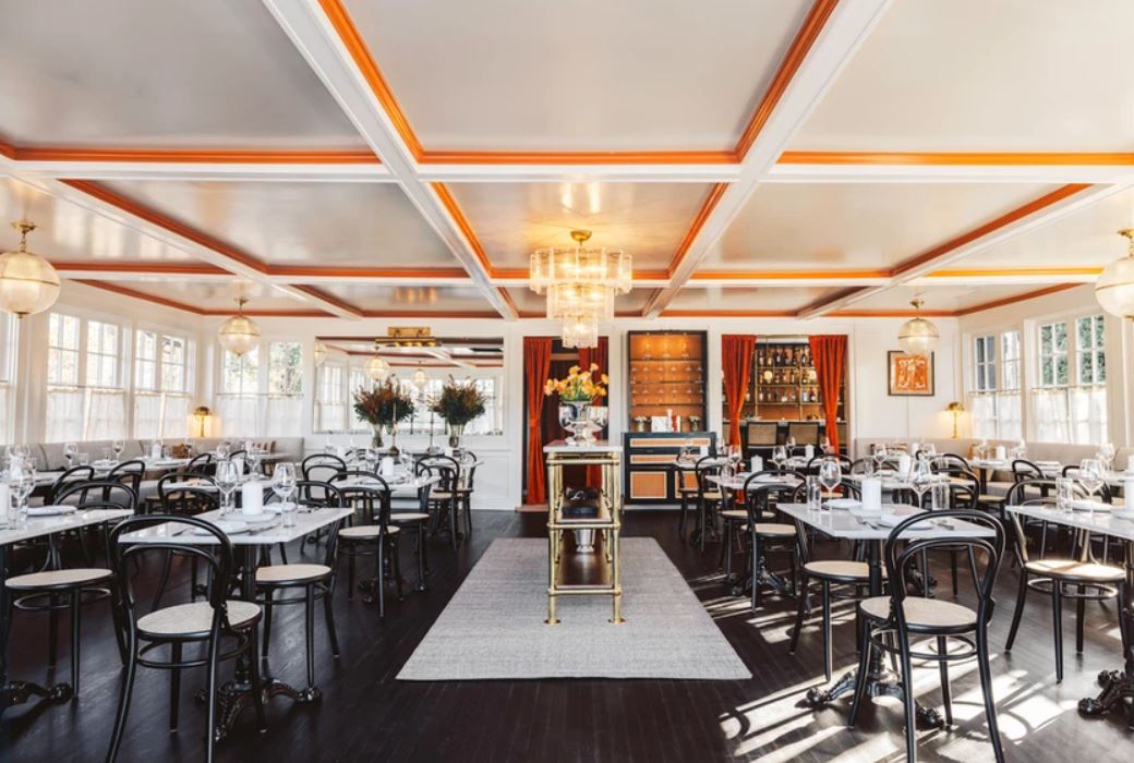 210 Hampton Road Southampton, NY 11968 - Photo 32 of 34 a view of a dining hall with many windows