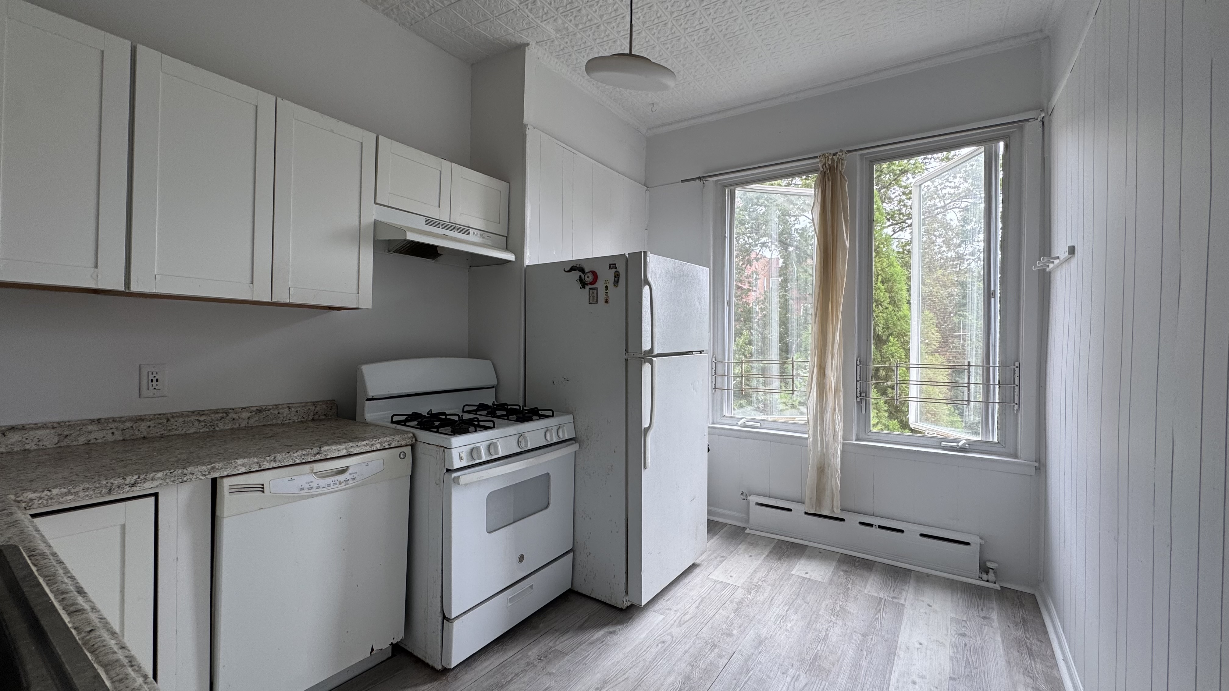 196 Seeley Street, Unit 2 Brooklyn, NY 11218 - Photo 1 of 7 a kitchen with appliances cabinets and a window